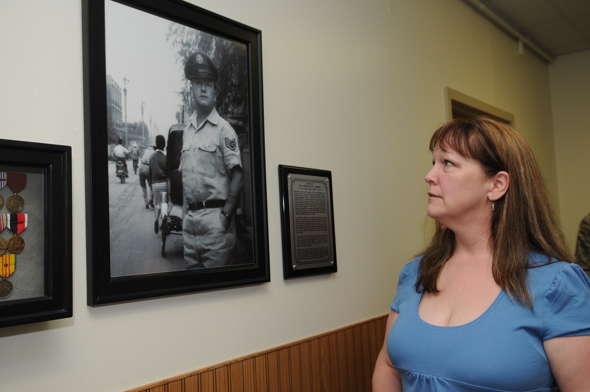 GOODFELLOW AIR FORCE BASE, Texas -- Sylene Peterson, daughter of Tech. Sgt. Fred Sebers, views a photo of her father, April 15, 2010. Sergeant Sebers was killed in 1967 while assigned to Det. 1, 6994th Security Squadron, Nha Trang, Republic of Vietnam. His family visited Goodfellow to see the building dedicated to his memory. (U.S. Air Force photo/Airman 1st Class Clayton Lenhardt)