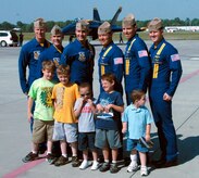 Five children sponsored by the South Carolina Make-A-Wish Foundation join for a photo with the U.S. Navy Blue Angels aerial demonstration team April 16, 2010, on the flightline at Joint Base Charleston, S.C. Children with life-threatening conditions like cystic fibrosis and leukemia make the children eligible for the Make-A-Wish Foundation program. The Make-A-Wish Foundation mission is to grant the wishes of children with life-threatening medical conditions to enrich the human experience with hope, strength and joy. More information on their mission is available at www.sc.wish.org. (U.S. Air Force photo/Senior Airman Timothy Taylor)