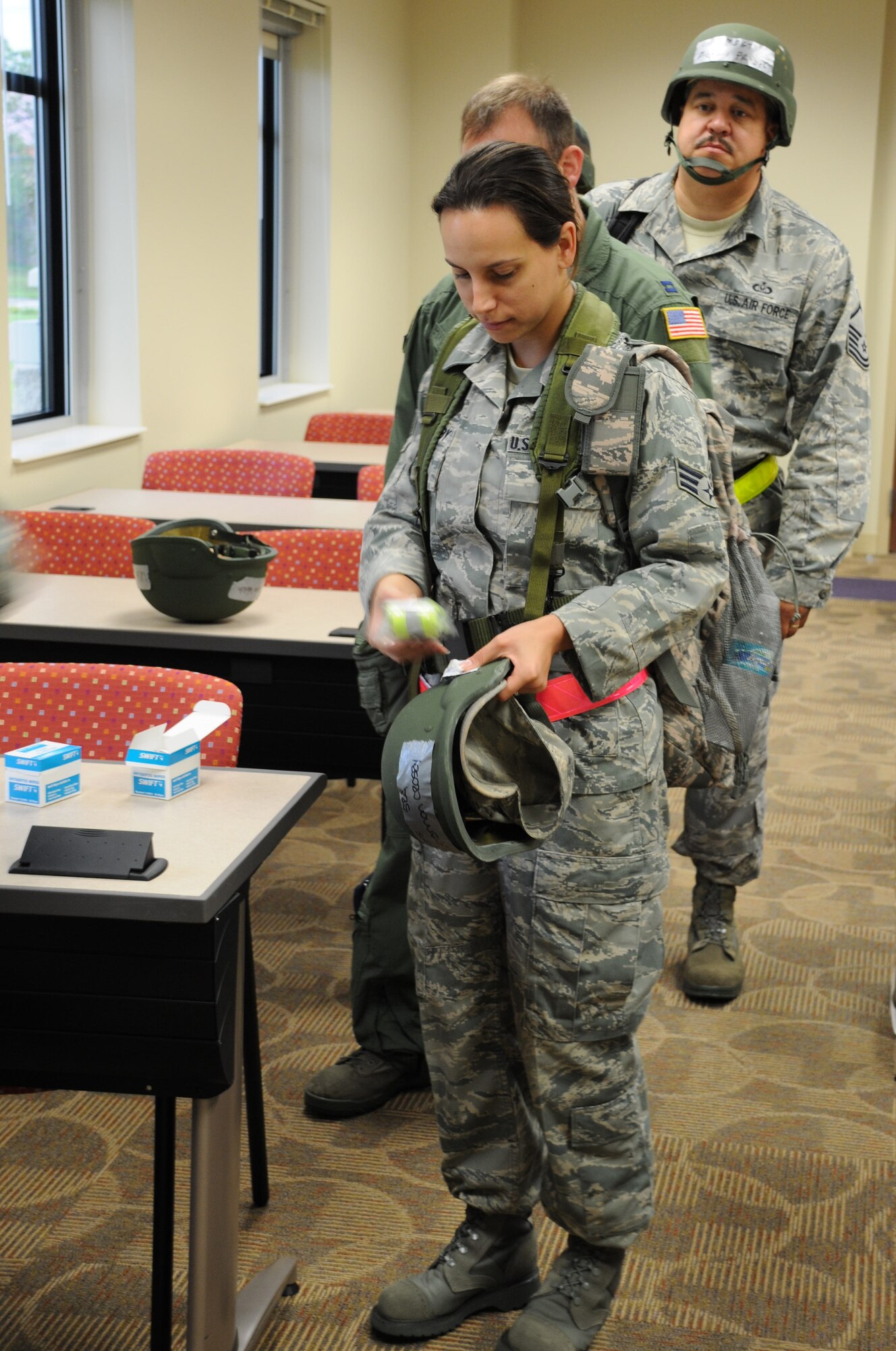 Airmen from the 927th Air Refueling Wing are issued reflective belts for a mobility exercise at MacDill Air Force Base, Fla., April 20, 2010. The exercise is the first of many scheduled over the course of the year in preparation for an Operational Readiness Inspection slated for January 2011. (U.S. Air Force photo by Senior Airman Anna-Marie Wyant)