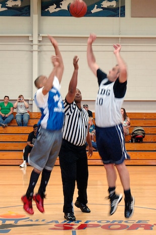 Justin Steidler, right, and Quinton Valentine, left, battle for the ball at tip off during the base intramural basketball championship game held at the Fitness and Sports Center April 16, 2010, at Joint Base Charleston, S.C. After trailing in the first half by 16 points, the 628th Medical Group defeated the 437th Maintenance Squadron 38-32 for the top spot. Steidler is assigned to the 628 MDG, and Valentine is assigned to the 437 MXS. (U.S. Air Force photo/Staff Sgt. Marie Brown)