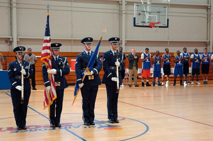 Members of the base Honor Guard post the colors prior to tip off at the intramural basketball championship game held at the Fitness and Sports Center April 16, 2010, at Joint Base Charleston, S.C. The 628th Medical Group and the 437th Maintenance Squadron played for the base championship. The 628 MDG defeated the 437 MXS 38-32. (U.S. Air Force photo/Staff Sgt. Marie Brown)