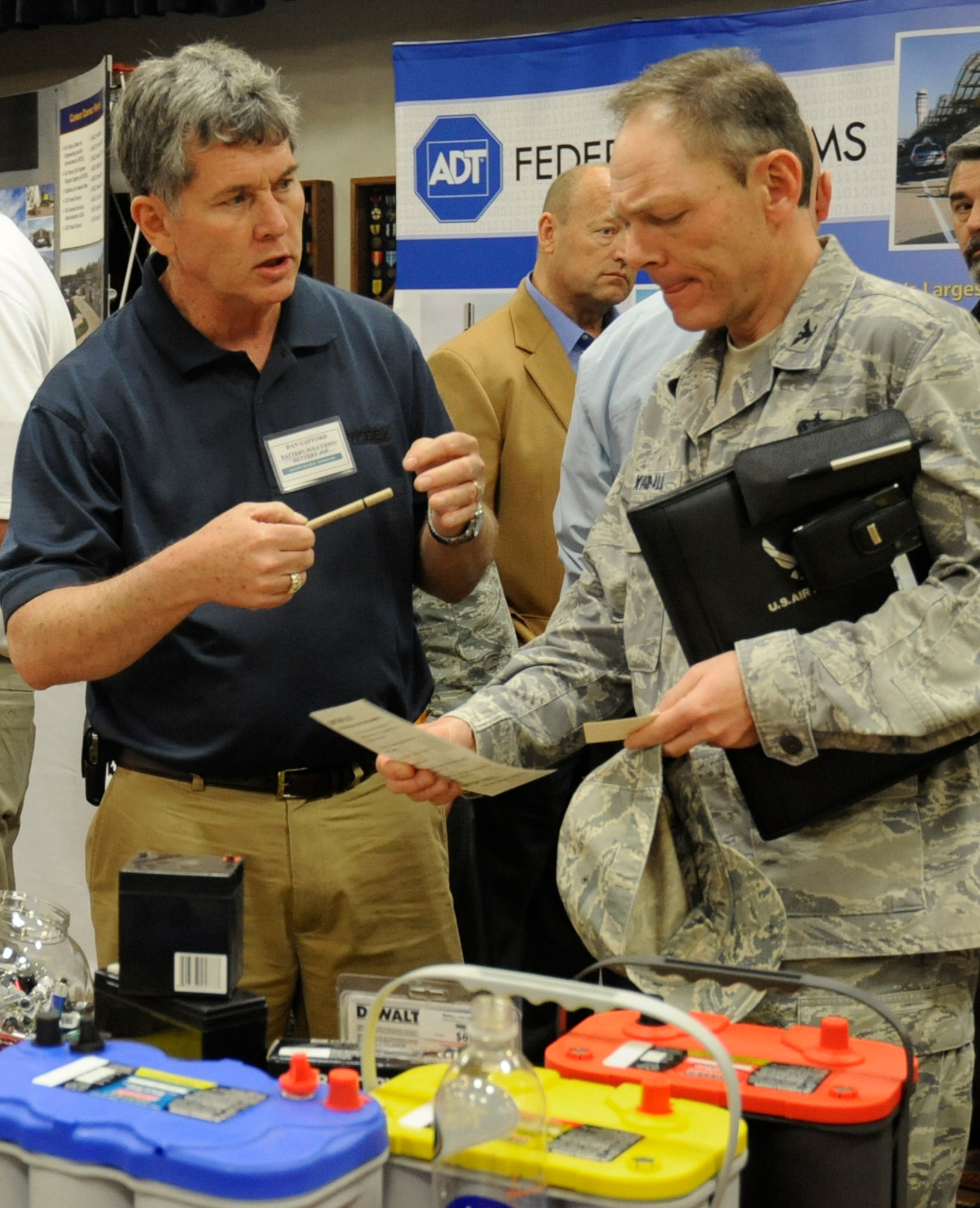 Dan Gafford, a Battery Solutions Inc. employee, speaks with Col. Steven Kimball, 27th Special Operations Mission Support Group commander, during the Industry Day April 16.  Cannon Air Force Base hosted its first Industry Forum that included information on current and future base requirements and customer education for both internal military customers and contractors. (U.S. Air Force Photo by Senior Airman Evelyn Chavez)