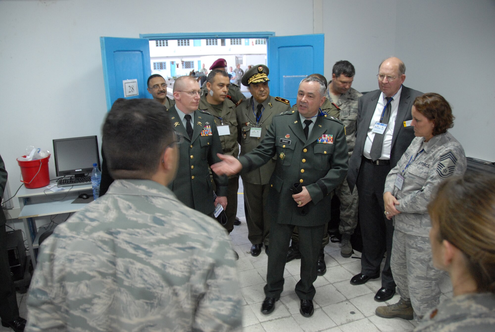 Maj. Gen. Edward L. Wright, adjutant general for Wyoming, Army Col. Luke Reiner, Wyoming National Guard joint operations officer and members of the Wyoming legislature, along with Tunisian and American military members, tour the Air Force command post for exercise MEDLITE-10 at Kharrouba Air Base, Tunisia. Tunisian and American medical personnel are working together to hone their medical and chemical contamination treatment techniques. (USAF Photo by Master Sgt. Paul Mann/Released) 