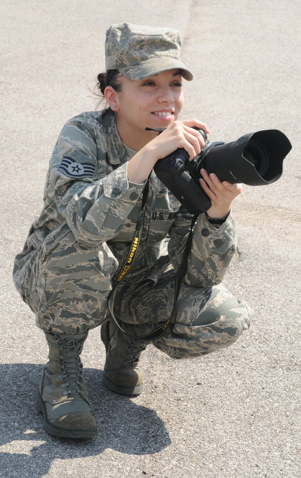 Staff Sgt. Nadine Y. Barclay, 31st Fighter Wing Public Affairs photographer, takes a photo as part of her job. Sergeant Barclay recently received the Outstanding Communication Airman Award for the 2009 Air Force Public Affairs Award for Communication Excellence. (U.S. Air Force photo/Staff Sgt. MercedesKimble Crossland)