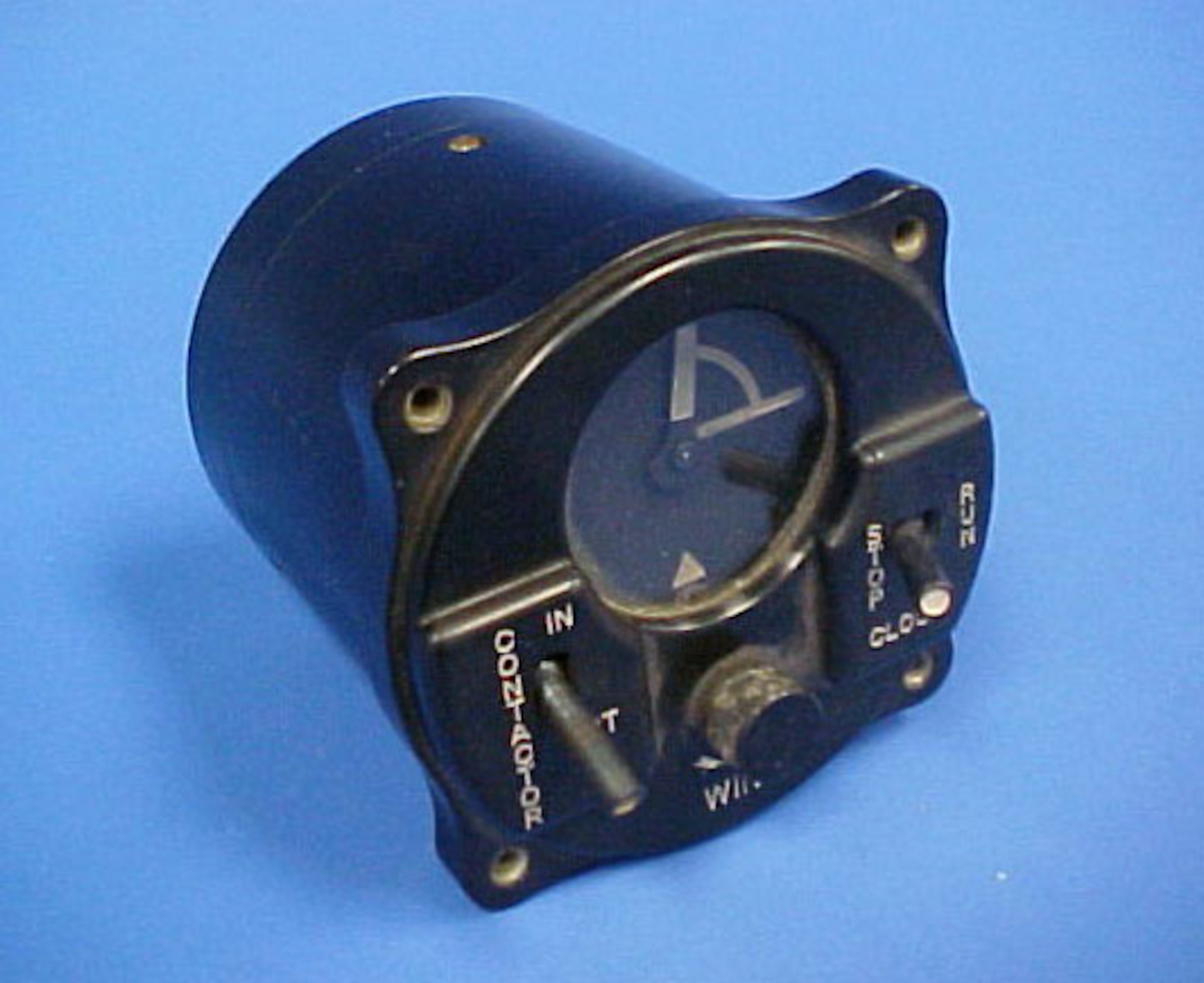 Installed in Allied aircraft as part of the Identification, Friend or Foe (IFF) program during World War II, this system would send a signal for 14 seconds of every minute over the pilot's radio to the ground station. The pilot could not speak while the unit was broadcasting. Designed to fit in a standard gauge slot, it has two switches (contactor in or out and clock stop or run), has one small knob (wind), and has clock face that indicates the time the unit is broadcasting. (U.S. Air Force photo)