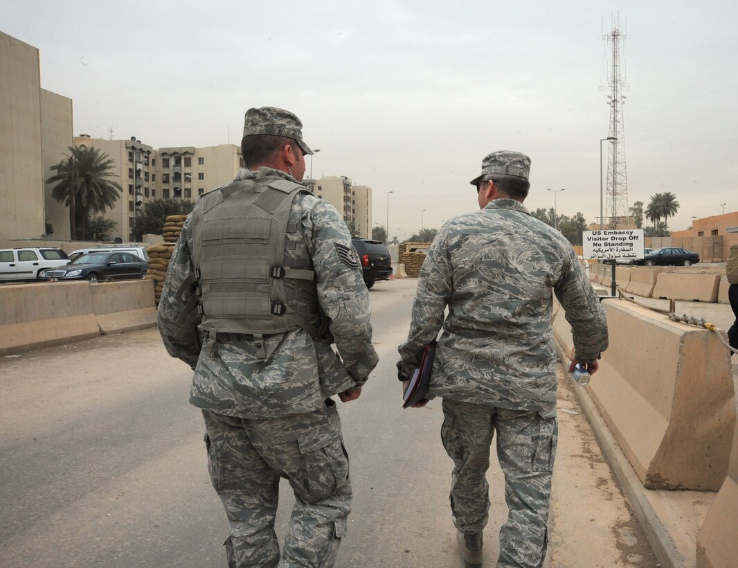 Air Force Tech. Sgt. Matt Loiselle, Personal Security Advisor for the Air Component Coordination Element Director, escorts the general while inside the U.S. Embassy compound, Baghdad, Iraq, March 24, 2010. Sergeant Loiselle has been in charge of three teams consisting of 40 Army personnel, who were deployed from locations such as the Kentucky and Tennessee Army National Guard units and he trained them to be part of this team.  (U.S. Air Force photo/Master Sgt. Trish Bunting/Released)