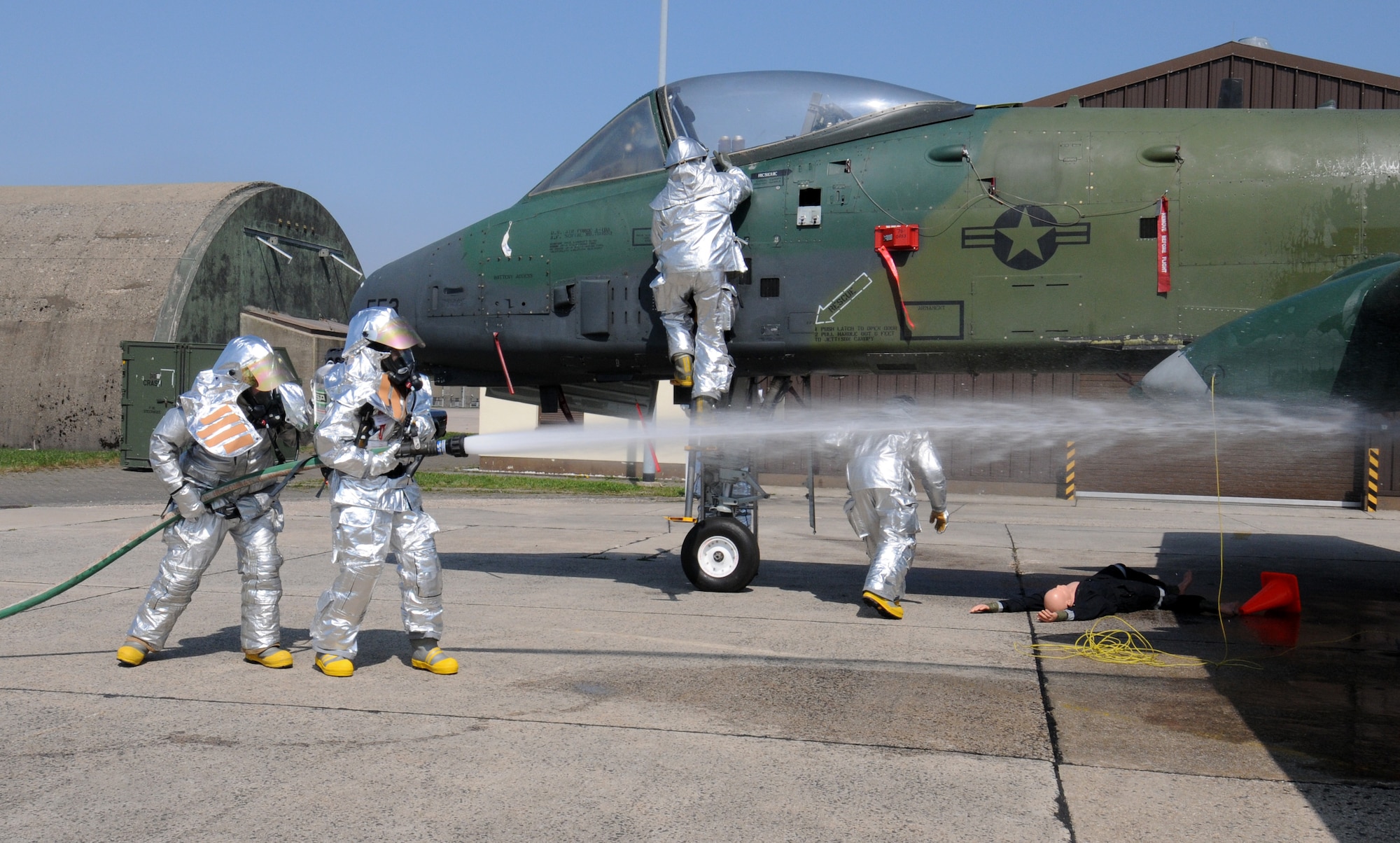 SPANGDAHLEM AIR BASE, Germany – Col. Jodine Tooke, lineman, 52nd Mission Support Group commander, participates in an emergency aircraft pilot egress exercise April 16. The 52nd Civil Engineer Squadron firefighters led Colonel Tooke through numerous firefighting exercises to provide first-hand experience. (U.S. Air Force photo/Airman 1st Class Staci Miller)
