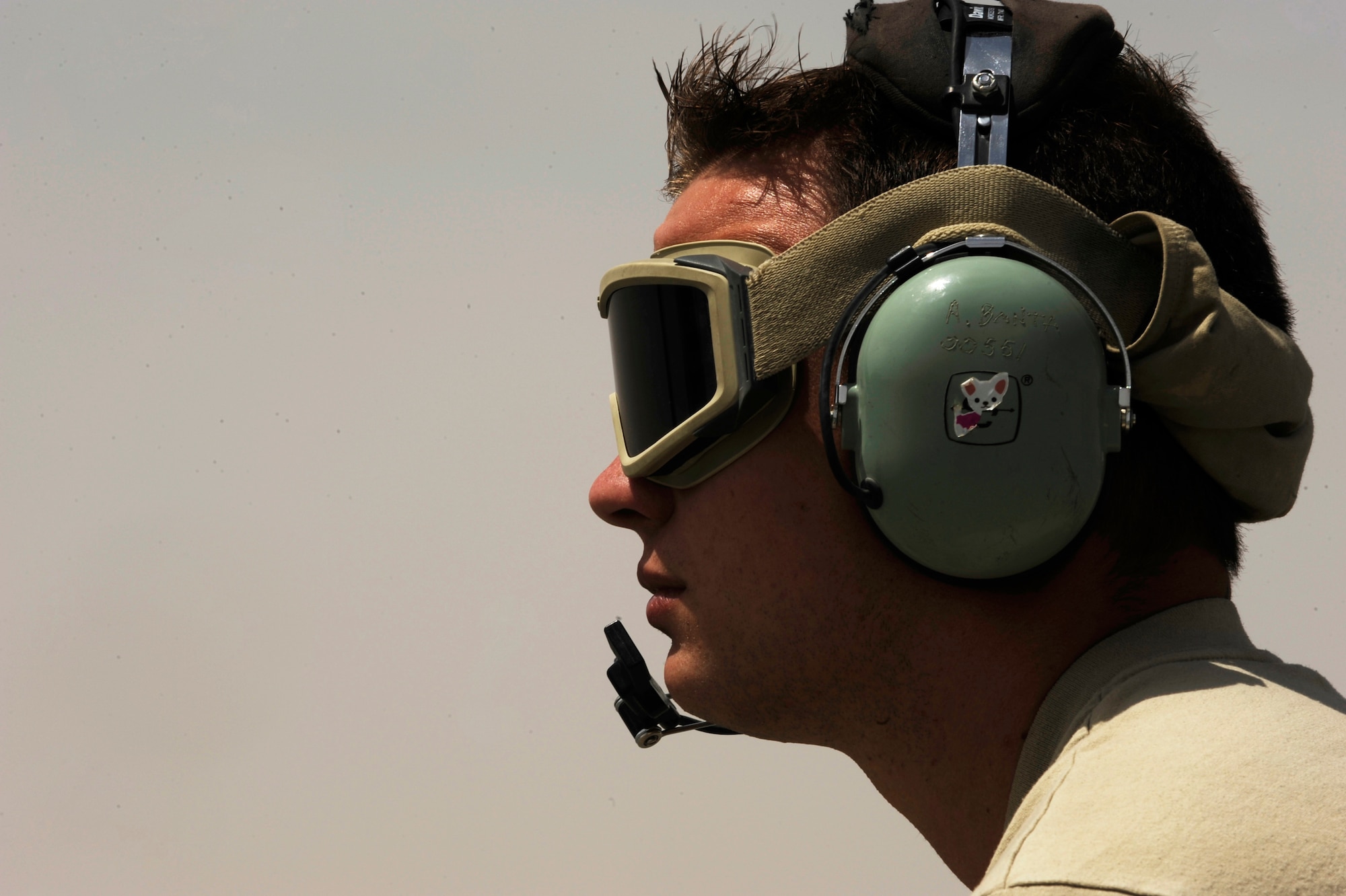 Staff Sgt. Mathew Reihle, an HH-60G Pave Hawk crew chief assigned to the 451st Expeditionary Aircraft Maintenance Squadron helicopter maintenance unit, waits for an HH-60G helicopter to take-off for an alert mission, April, 16, 2010, at Camp Bastion, Afghanistan. (U.S. Air Force photo/Staff Sgt. Manuel J. Martinez/released)
