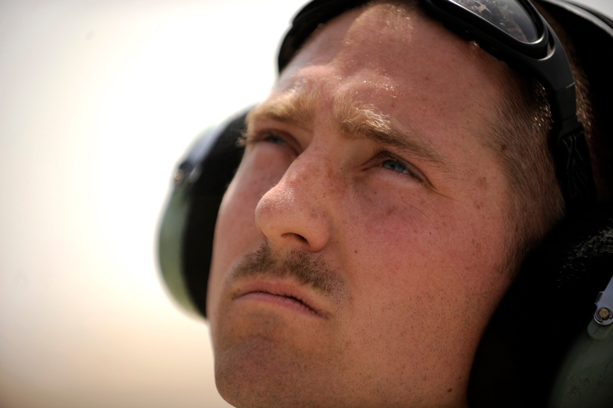Staff Sgt. Roger Anderson, an HH-60G Pave Hawk communications and navigations equipment specialist assigned to the 451st Expeditionary Aircraft Maintenance Squadron helicopter maintenance unit, observes an HH-60G helicopter as the aircrew shuts it off after returning from an alert mission, April, 16, 2010, at Camp Bastion, Afghanistan. (U.S. Air Force photo/Staff Sgt. Manuel J. Martinez/released)