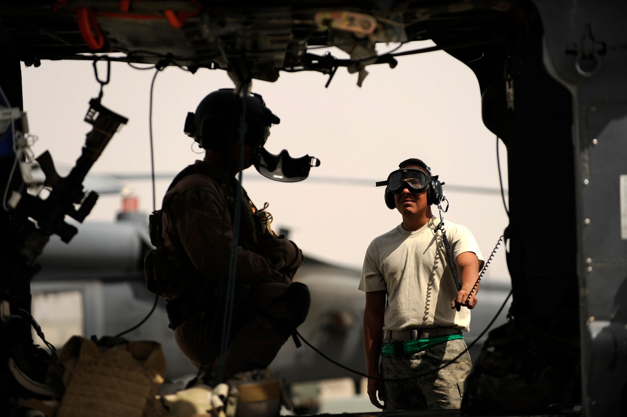 Senior Airman Robert Fabela, an HH-60G Pave Hawk crew chief assigned to the 451st Expeditionary Aircraft Maintenance Squadron helicopter maintenance unit, observes the rotors as a pilot shuts down the engines after returning from an alert mission, April, 16, 2010, at Camp Bastion, Afghanistan. ?Our guys have very little down time,? said Tech. Sgt. Dennis Deaton, 451st EAMXS HMU expeditor deployed from Nellis AFB, Nev. ?Our guys are out there and ready to perform the mission in all kinds of weather at anytime. We don?t work on a regular time clock, when we get a call the aircraft have to fly and we put the work in to make it happen.? (U.S. Air Force photo/Staff Sgt. Manuel J. Martinez/released)