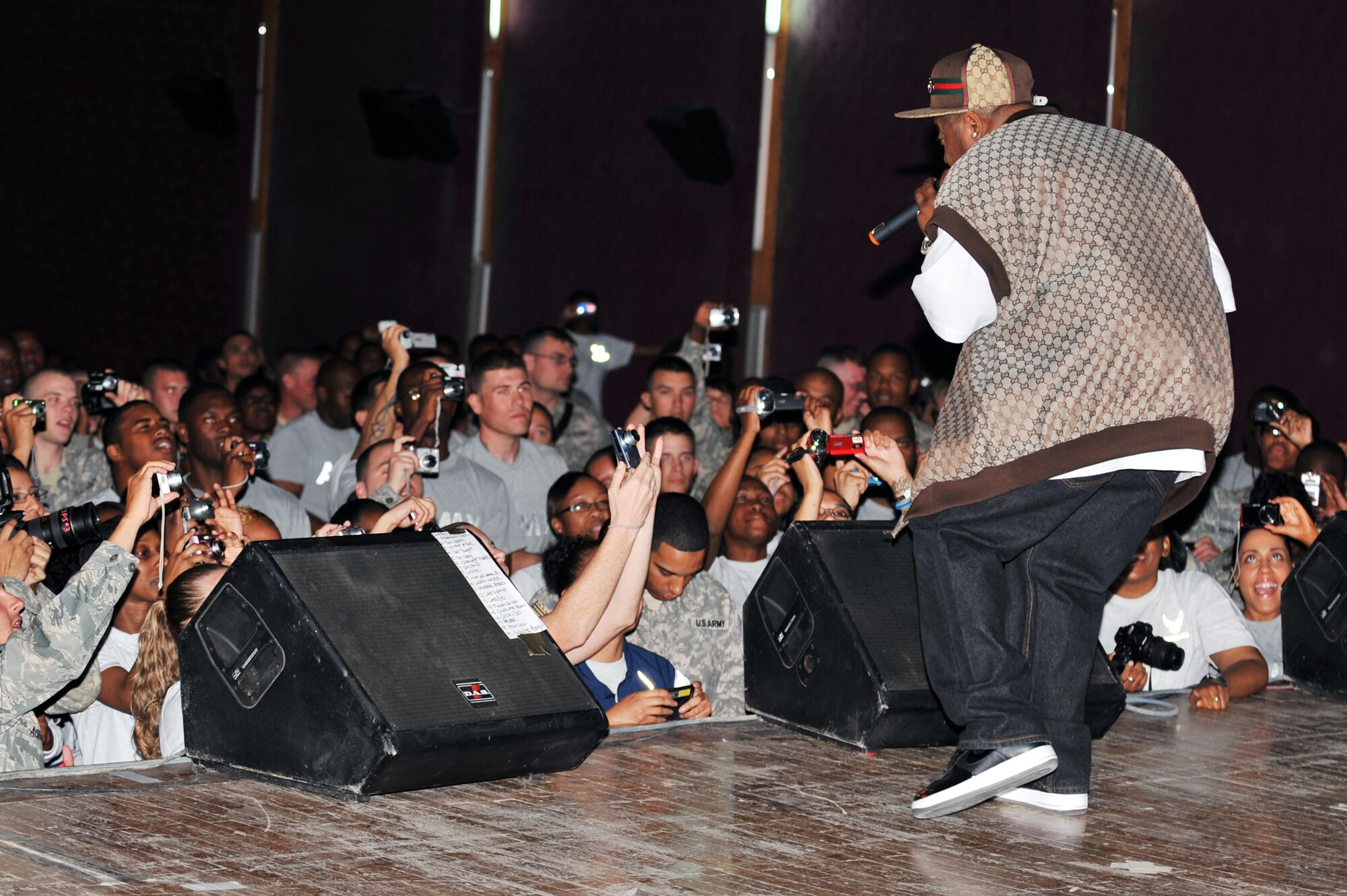 Twista performs for more than 600 deployed servicemembers and contractors at Joint Base Balad, Iraq, April 15, 2010. After the concert, audience members lined up for a meet-and-greet and autograph session with the artist. (U.S. Air Force photo/Senior Airman Brittany Y. Bateman/Released)