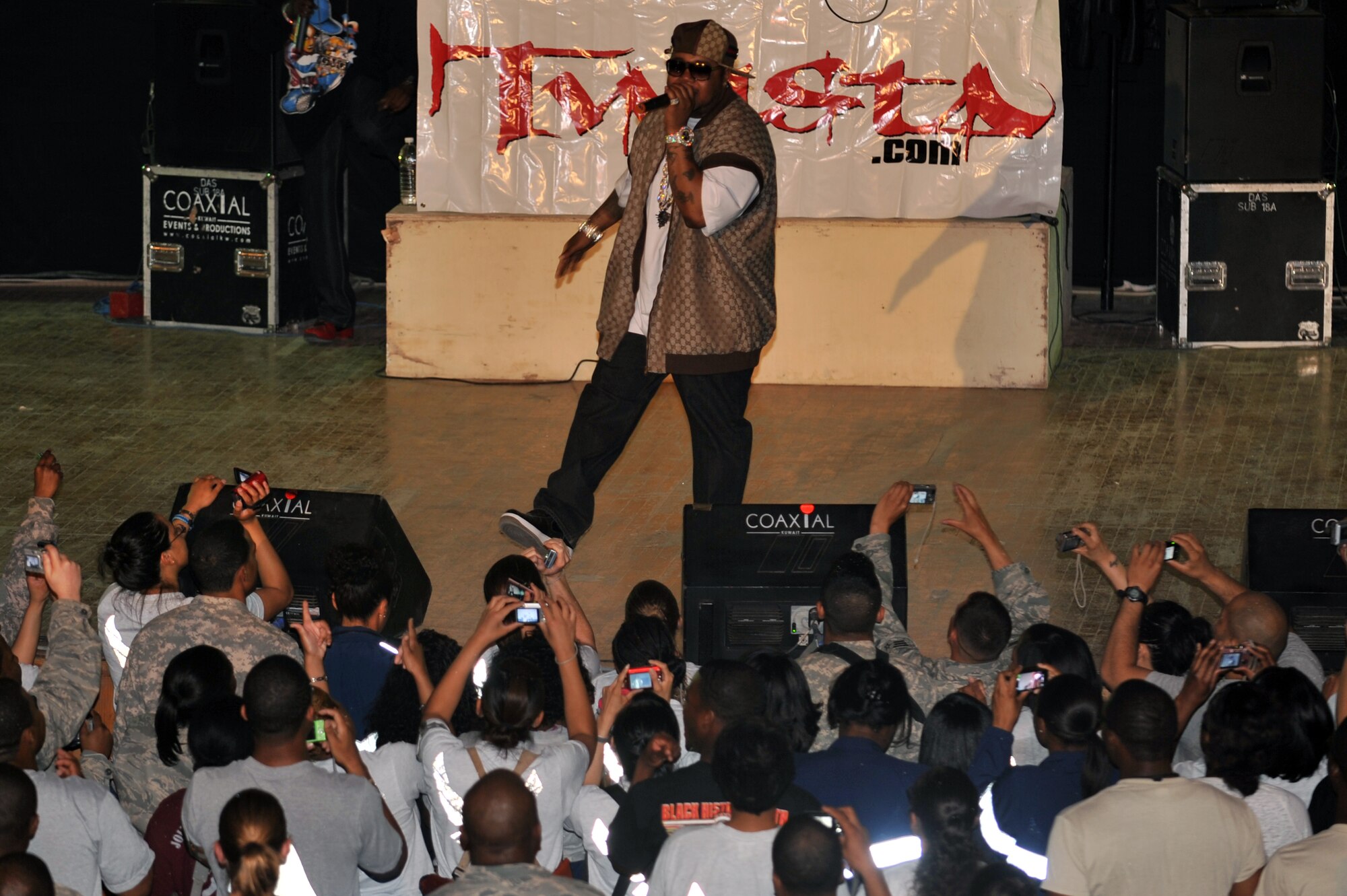 Twista performs for more than 600 deployed servicemembers and contractors at Joint Base Balad, Iraq, April 15, 2010. After the concert, audience members lined up for a meet-and-greet and autograph session with the artist. (U.S. Air Force photo/Senior Airman Brittany Y. Bateman/Released)