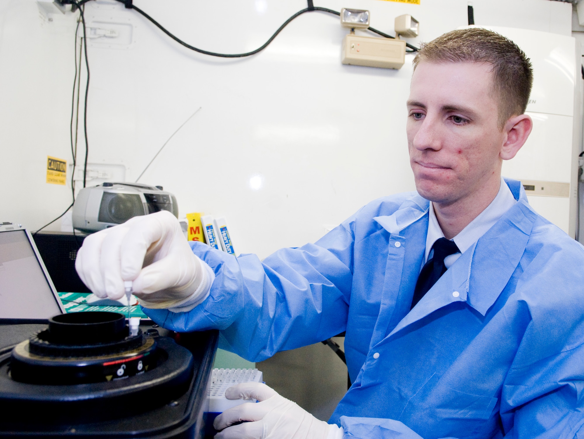 KUNSAN AIR BASE, Republic of Korea -- Senior Airman Jon Ringenoldus, a laboratory technician from the 8th Medical Support Squadron, performs a test on a joint biological identification and diagnostic system. April 18-24 is National Medical Laboratory Professional Week, a weeklong of recognizing the contributions of what the laboratory technicians provide to medical health care. (U.S. Air Force photo/Senior Airman Jonathan Steffen)