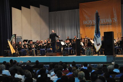 The U.S. Army Field Band and Soldiers Chorus, led by conductor and commander Col. Thomas Palmatier, plays for a packed Boys Town Music Hall, in Omaha, Neb. April 20. The concert featured patriotic music and singing by the Army Field Band Chorus. Selections included songs from the classic American play &quot;Annie Get Your Gun&quot; and singer/song writers Paul Simon and Art Garfunkel. More than 1,200 people from the Omaha community and Boys Town residents attended the concert.