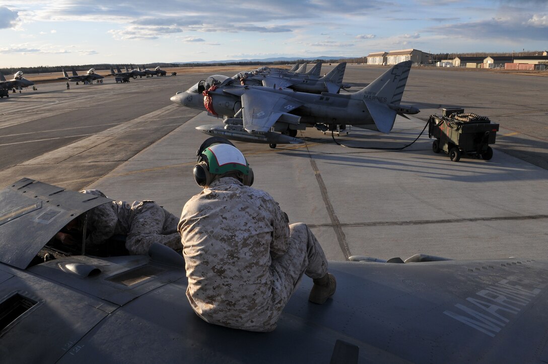 Marine Attack Squadron 211 flight safety equipment mechanics Lance Cpl. Dominik Adamski, left, and Lance Cpl. Charles Hawkins do a maintenance check on a squadron AV-8B Harrier on the flight line of Eielson Air Force Base, Alaska, April 20, 2010. The Yuma-based Marines returned home May 4, 2010, with approximately 165 other VMA-211 Marines after two-and-a-half weeks of aerial warfare training in Exercise Red Flag-Alaska, one of the largest joint-service exercises in the U.S. military.