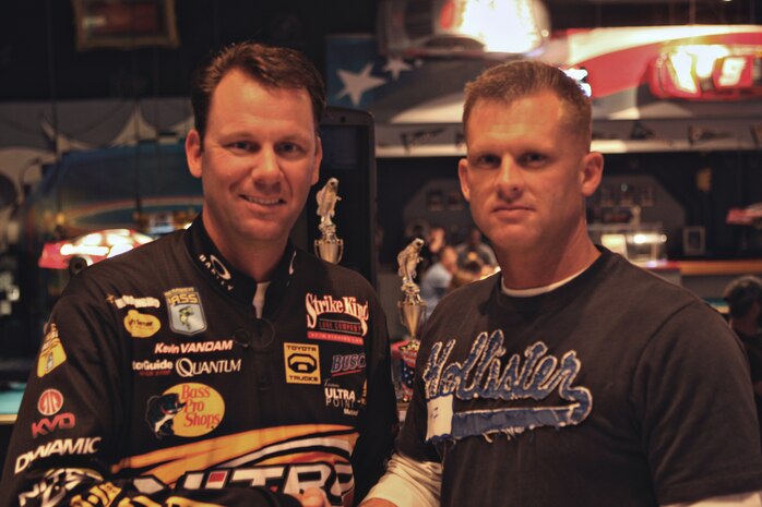 Master Sgt. Anthony Ball, correctional specialist with Headquarters and Support Battalion, Marine Corps Base Camp Lejeune, N.C., stands with Kevin Van Dam, three-time Bassmaster Classic winner and five-time Toyota Tundra Angler of the Year winner, during the 2010 Warriors on the Water Bass Fishing Tournament held at Lake Jordan in Raleigh, N.C., April 23. Marines from HQSPTBn as well as other soldiers, sailors and airmen from other bases competed against each other during this military appreciation event.