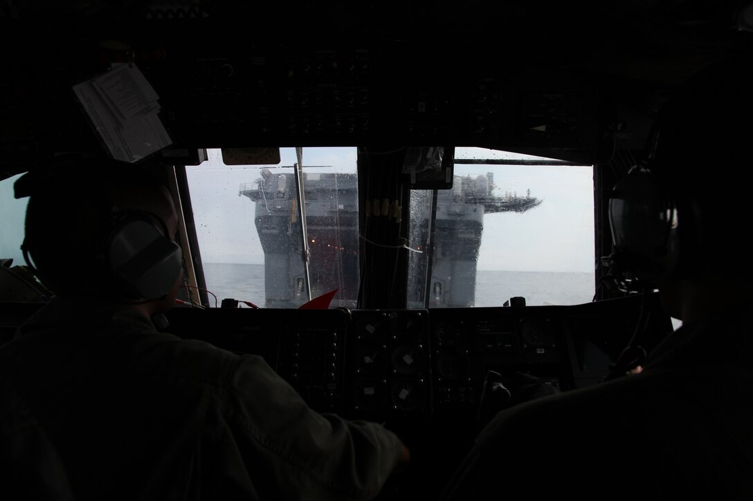 Chief Petty Officer Marc W. Kinney, an electronic technician chief and Petty Officer 2nd Class Cesar A. Aguilar,a gas turbine systems mechanic with Assault Craft Unit 4, pilot their Landing Craft Air Cushioned aboard USS Kearsarge off the shore of  Onslow Beach, Camp Lejeune, NC, April 21, 2010. The LCACs transported Marines and equipment from Battalion Landing Team 3/8, 26th Marine Expeditionary Unit onto USS Kearsarge. Marines from 26th MEU will be introduced to life aboard the ships and are conducting an Amphibious Squadron (PHIBRON) MEU Integration Training (PMINT) exercise aboard USS Kearsarge, USS New York, and USS Carter Hall.