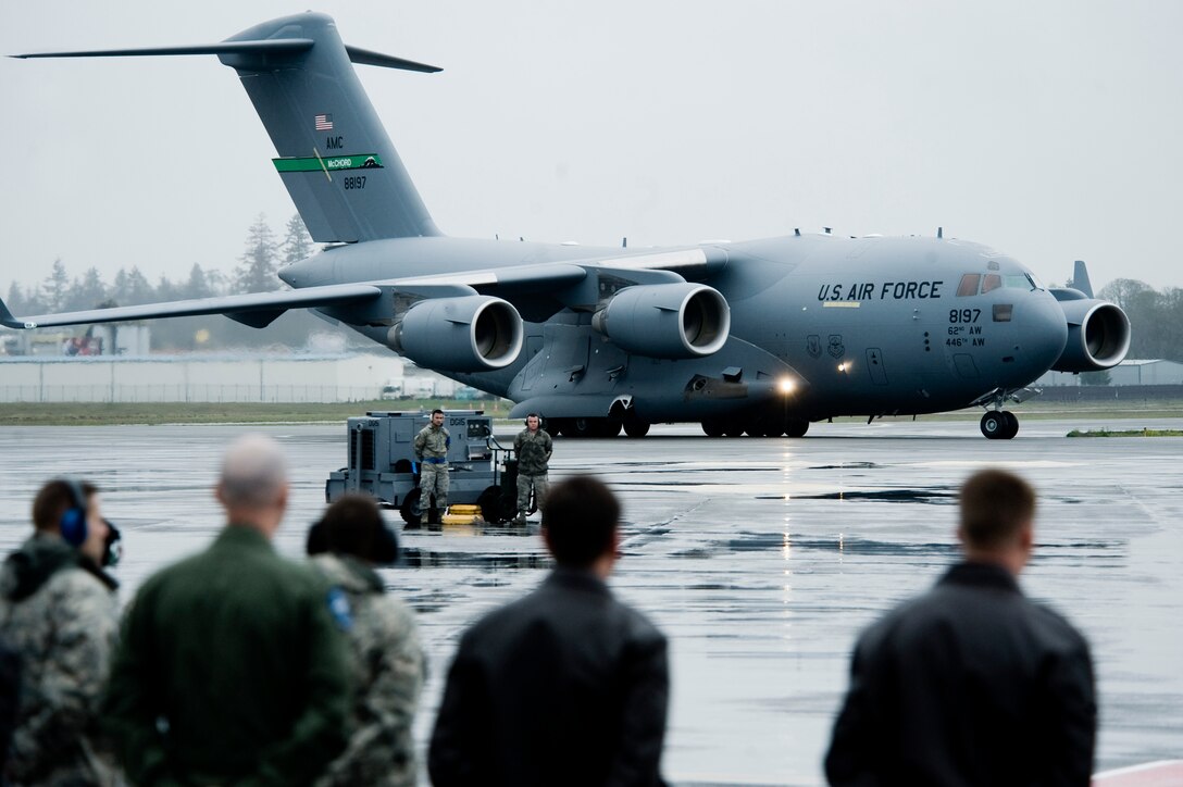 A C-17 Globemaster III, piloted by Brig. Gen. Michael D. Kim, mobilization assistant to the Director of Operations, Headquarters Air Mobility Command, Scott Air Force Base, Ill, taxis to a parking spot on the McChord Field flightline April 21.   The aircraft is straight from the Boeing factory in Long Beach, Calif., and is the newest addition to the Air Force's fleet of C-17's. (U.S. Air Force Photo by Abner Guzman)

