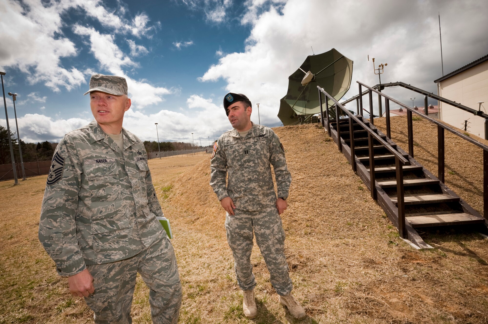 MISAWA AIR BASE, Japan -- U.S. Army Captain Erol Munir, Joint Tactical Ground Station commander, gives Chief Master Sgt. Richard Kaiser, 5th Air Force command chief master sergeant, a tour of JTAGS April 21. Chief Kaiser visited the facility to learn about the Army's role in the defense of northern Japan. (U.S. Air Force photo/Staff Sgt. Samuel Morse)