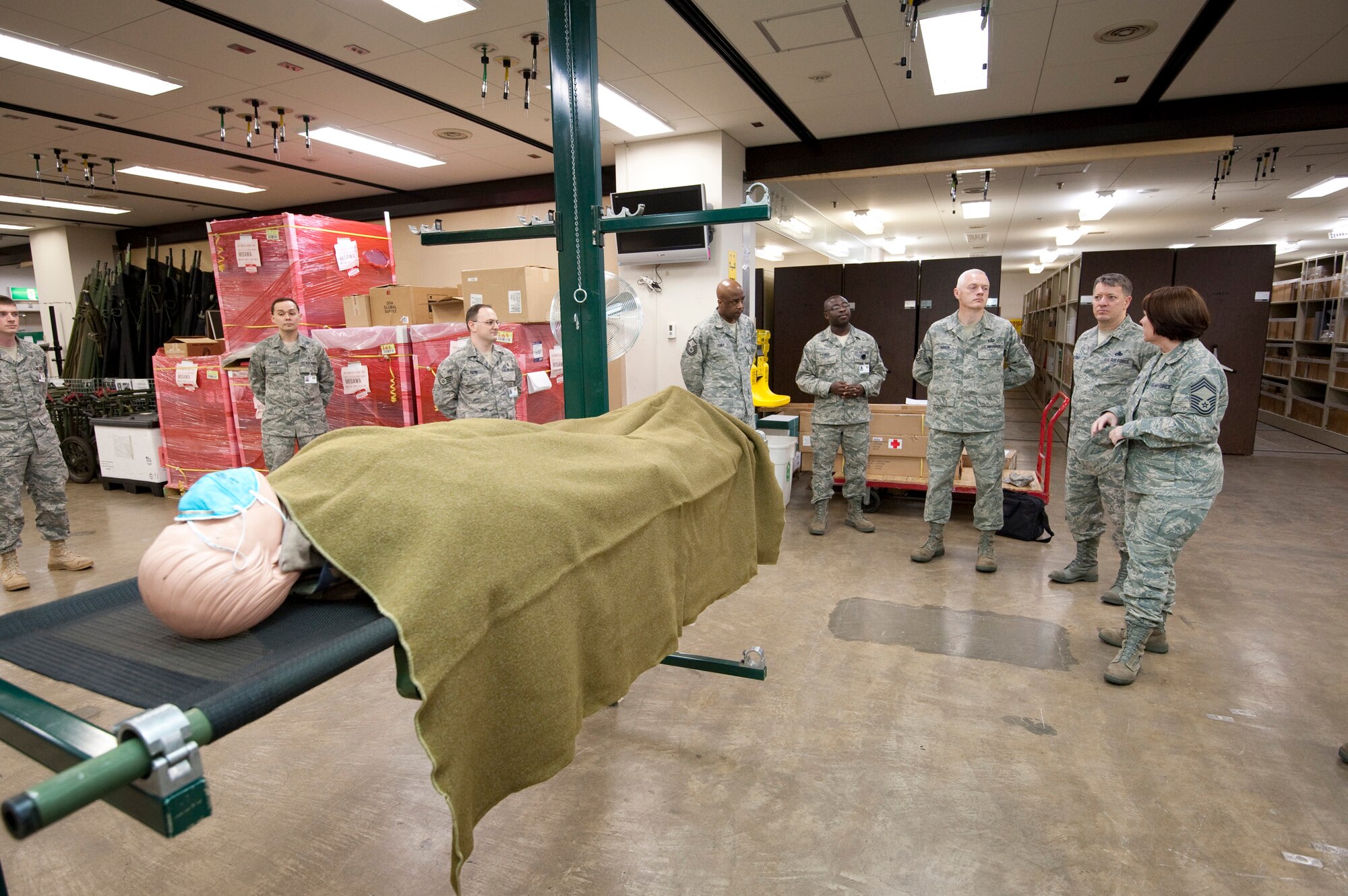 MISAWA AIR BASE, Japan -- Chief Master Sgt. Richard Kaiser, 5th Air Force command chief master sergeant, tours through the patient bed expansion facility at the hospital April 21. The bed expansion section allows the hospital to accommodate more patients than their normal capacity. (U.S. Air Force photo/Staff Sgt. Samuel Morse)