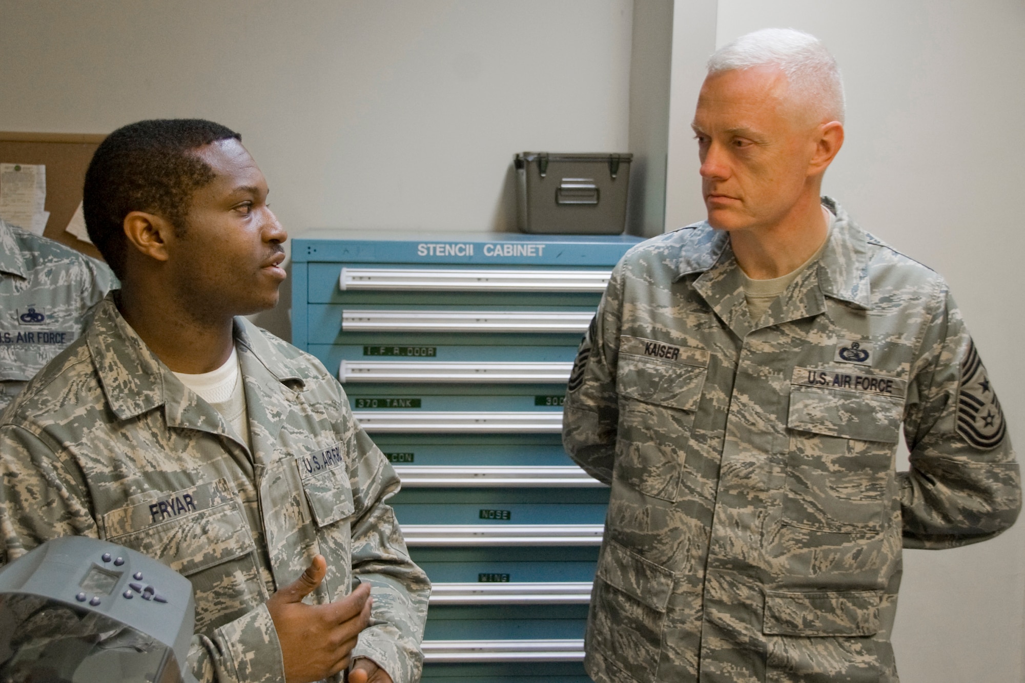MISAWA AIR BASE, Japan -- Staff Sgt. Henry Fryar, 35th Maintenance Squadron corrosion NCO in charge, explains the F-16 paint process to Chief Master Sgt. Richard Kaiser, 5th Air Force command chief master sergeant, April 20 at the aircraft structure maintenance shop. Chief Kaiser toured flights of the 35th MXS and had lunch with the Airmen at the Falcon Feeder dining facility. (U.S. Air Force photo/Senior Airman Jamal D. Sutter)