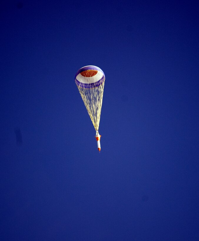 A 77,000-pound jumbo drop test vehicle floats to the ground from 25,000 feet over the U.S. Army Yuma Proving Ground April 14.  A C-17 from 418th Flight Test Squadron set a record for the heaviest single load ever dropped during flight.  NASA photo