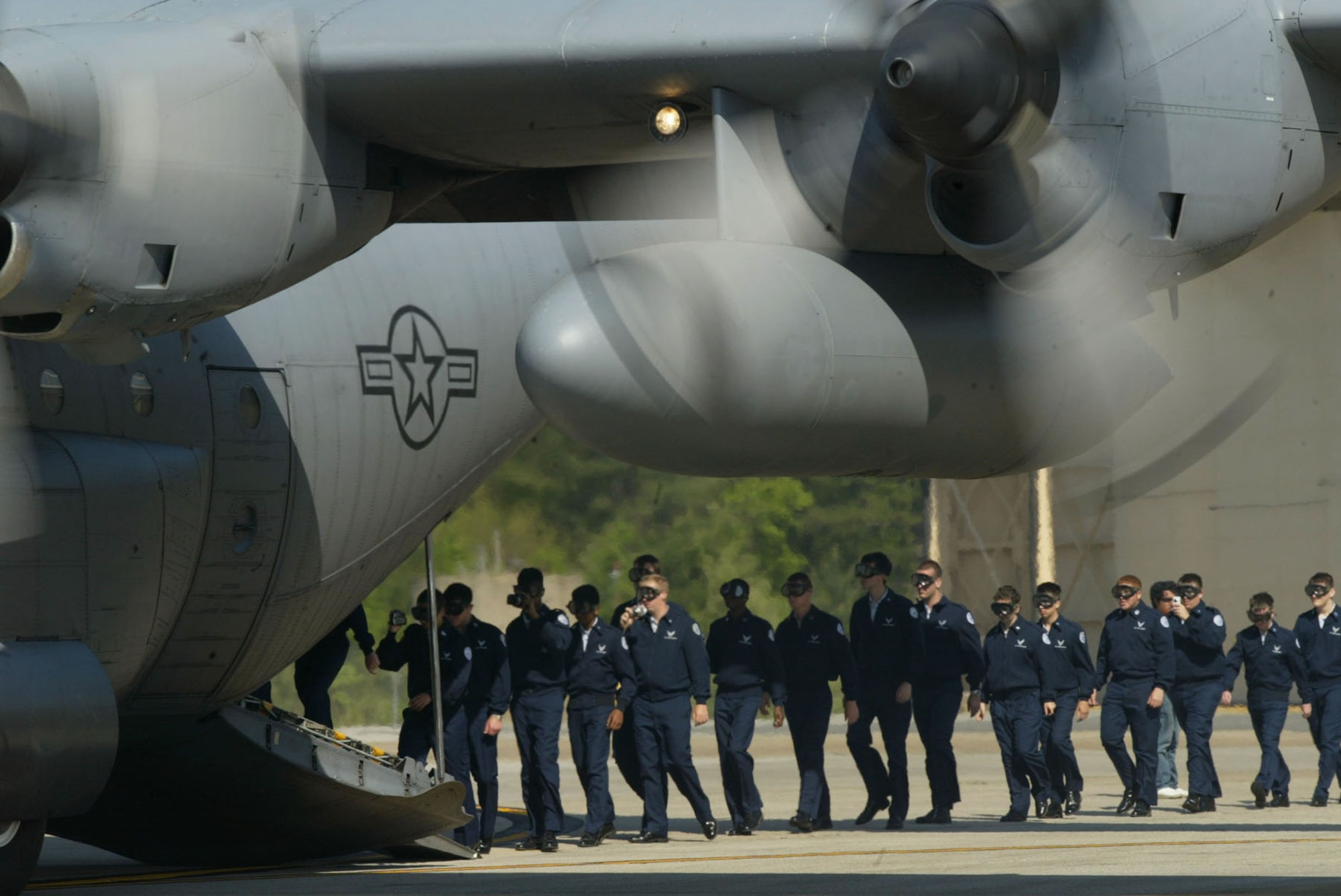 Air Force JROTC cadets file onto the C-130 transport aircraft in preparation of their orientation flight during the 2010 JROTC visit held here April 14. Orientation flights are designed to introduce youth to general aviation and military opportunities through hands-on interaction with aircraft, equipment and personnel. (U.S. Air Force photo/Don Peek)