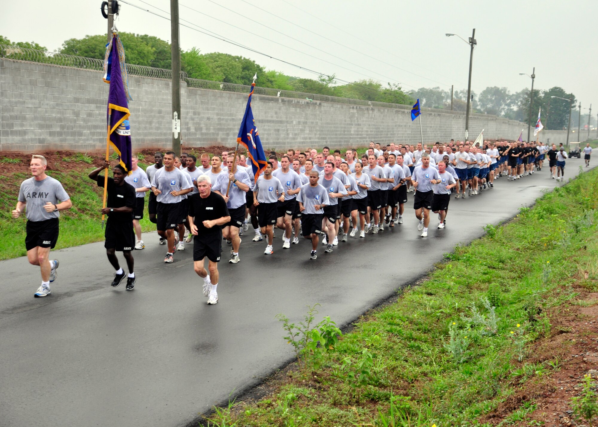 Joint Task Force-Bravo members participate in a monthly base run April 20 to build camaraderie and promote fitness across the different units at Soto Cano Air Base, Honduras. Army Col. Gregory Reilly, JTF-Bravo Commander, also took time to commend the Airmen, Soldiers, Sailors and Marine on the job they have been doing carrying out the mission of JTF-Bravo. (U.S. Air Force photo by Staff Sgt. Bryan Franks)