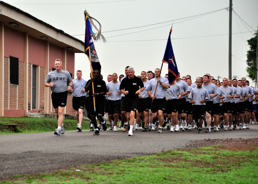 Members of Joint Task Force-Bravo take part in a monthly base run April 20 to build camaraderie and promote fitness across the different units at Soto Cano Air Base, Honduras. Col. Gregory Reilly, JTF-Bravo Commander, also took time to speak to the Airmen, Soldiers, Sailors and Marine and tell them how proud he was of the work they have accomplished. (U.S. Air Force photo by Staff Sgt. Bryan Franks) 