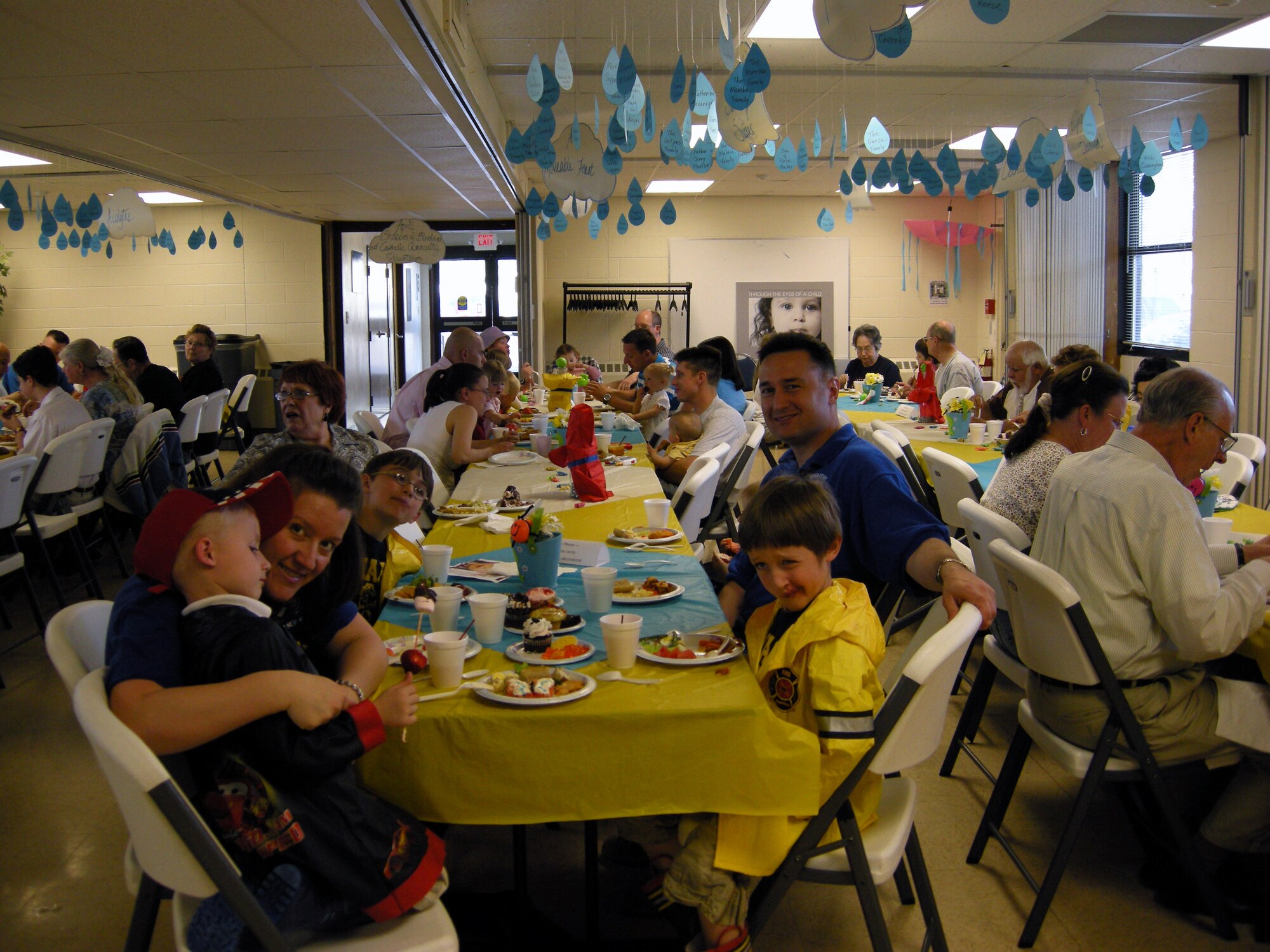 Scott and Pranava Moody and their children enjoy the Second Saturday Supper at the base chapel. Photo by Marie Vanover