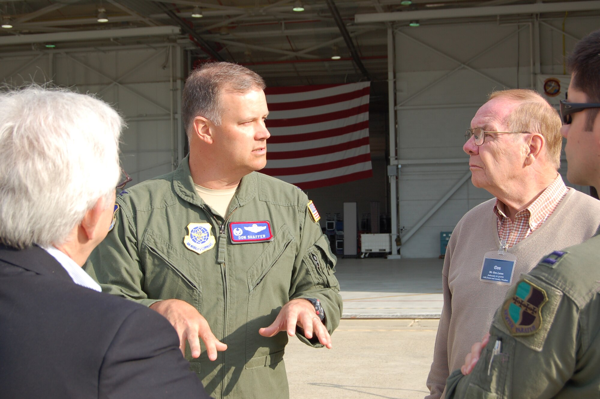 Col. Don Shaffer, 319th Air Refueling Wing commander, and local civic leaders, Don Larsen and Delore Zimmerman, discuss the mission transition of Grand Forks Air Force Base April 15 and 16 while on a tour of Global Hawks at Beale AFB, Calif. The tour was a chance for the civic leaders to learn about the capabilities, relevancy and importance of UAS operations within the Air Force.
