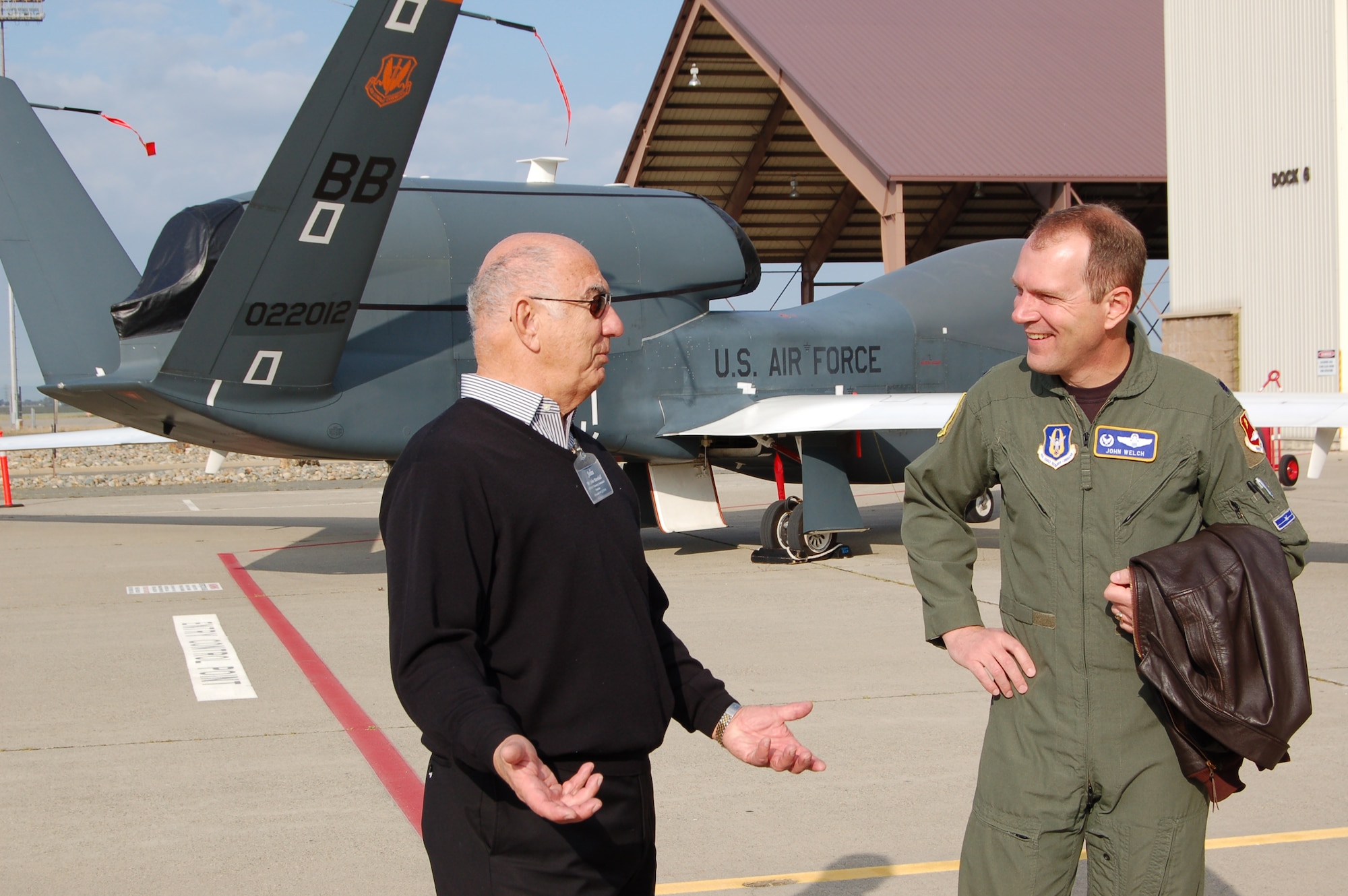 John Marshall (left), 319th Air Refueling Wing honorary commander emirates, and Lt. Col. John Welch, 13th Reconnaissance Squadron commander, discuss the Global Hawk mission April 15 and 16 during a civic leader’s tour to Beale Air Force Base, Calif. The tour was a chance for the civic leaders to learn about the capabilities, relevancy and importance of UAS operations within the Air Force.