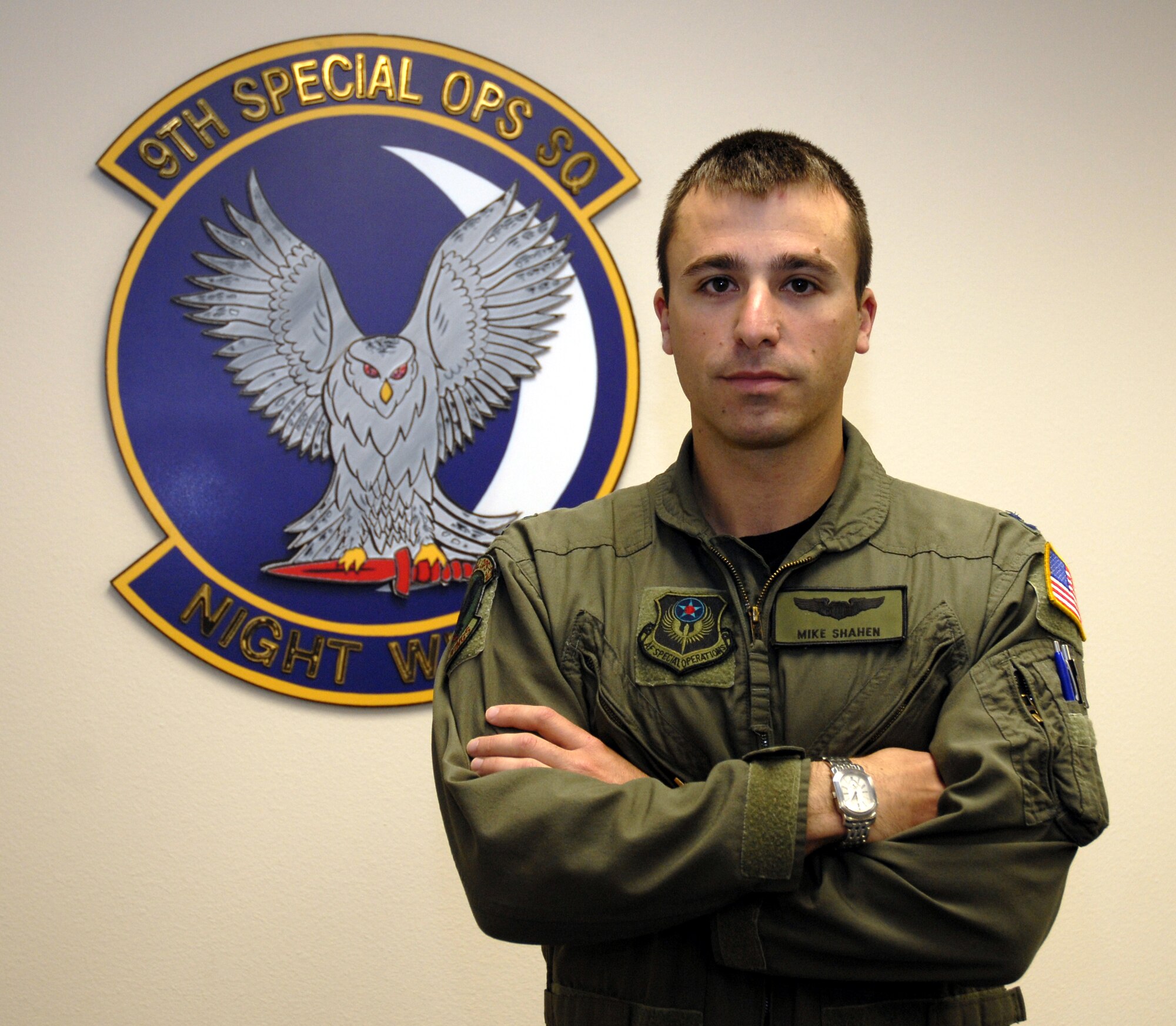 Capt. Michael Shahen, 9th Special Operations Squadron MC-130P aircraft commander and pilot, poses in front of the 9th SOS logo at his squadron's conference room at Eglin Air Force Base, Fla., April 21. Captain Shahen was selected for this week's "Tip of the Spear" spotlight. (DoD photo by U.S. Air Force Airman 1st Class Joe McFadden) (RELEASED)