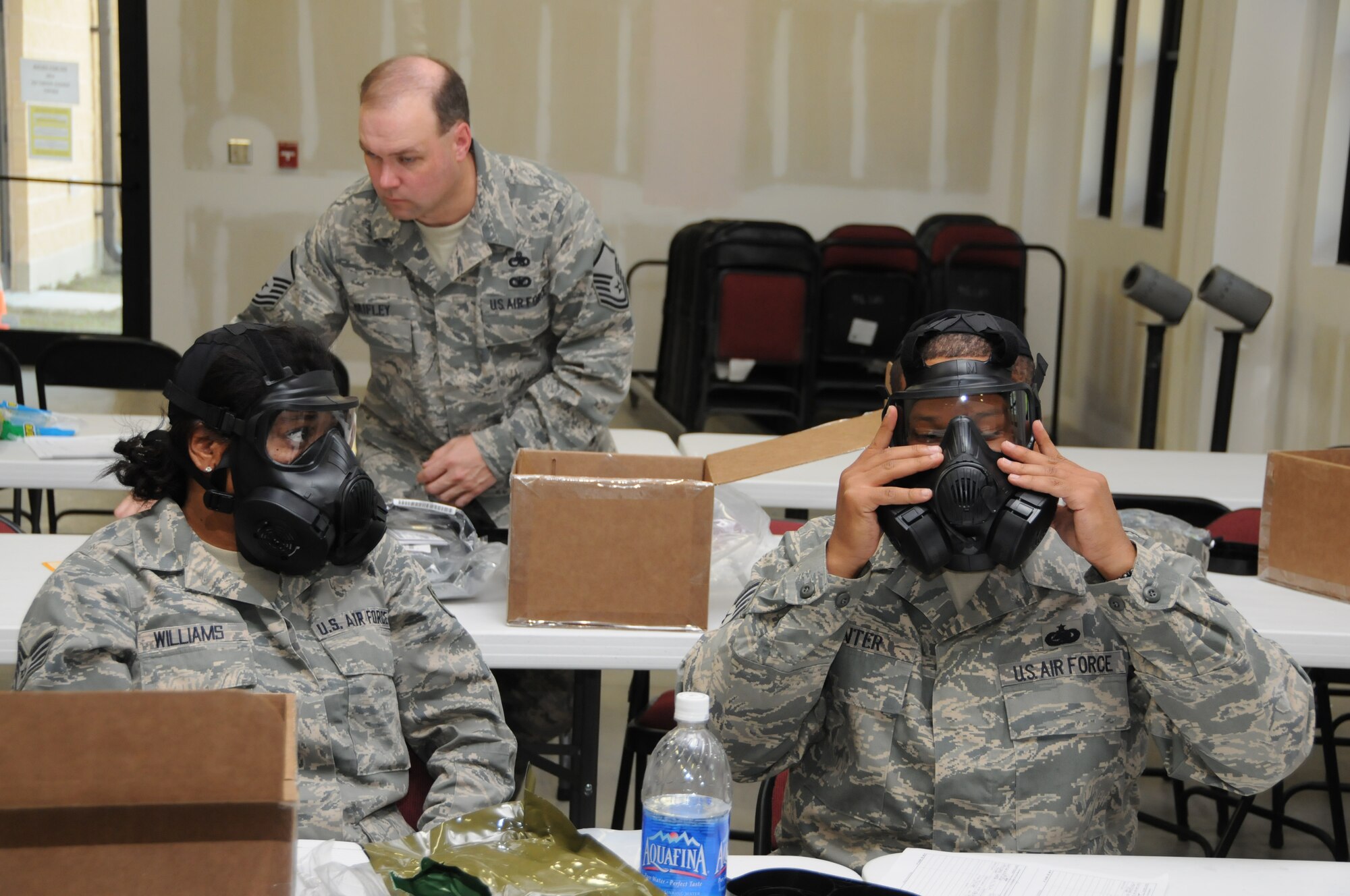 Airmen with the 916th Air Refueling Wing get training on the new M-50 gas mask. (USAF photo by TSgt. Scotty Sweatt, 916ARW/PA)