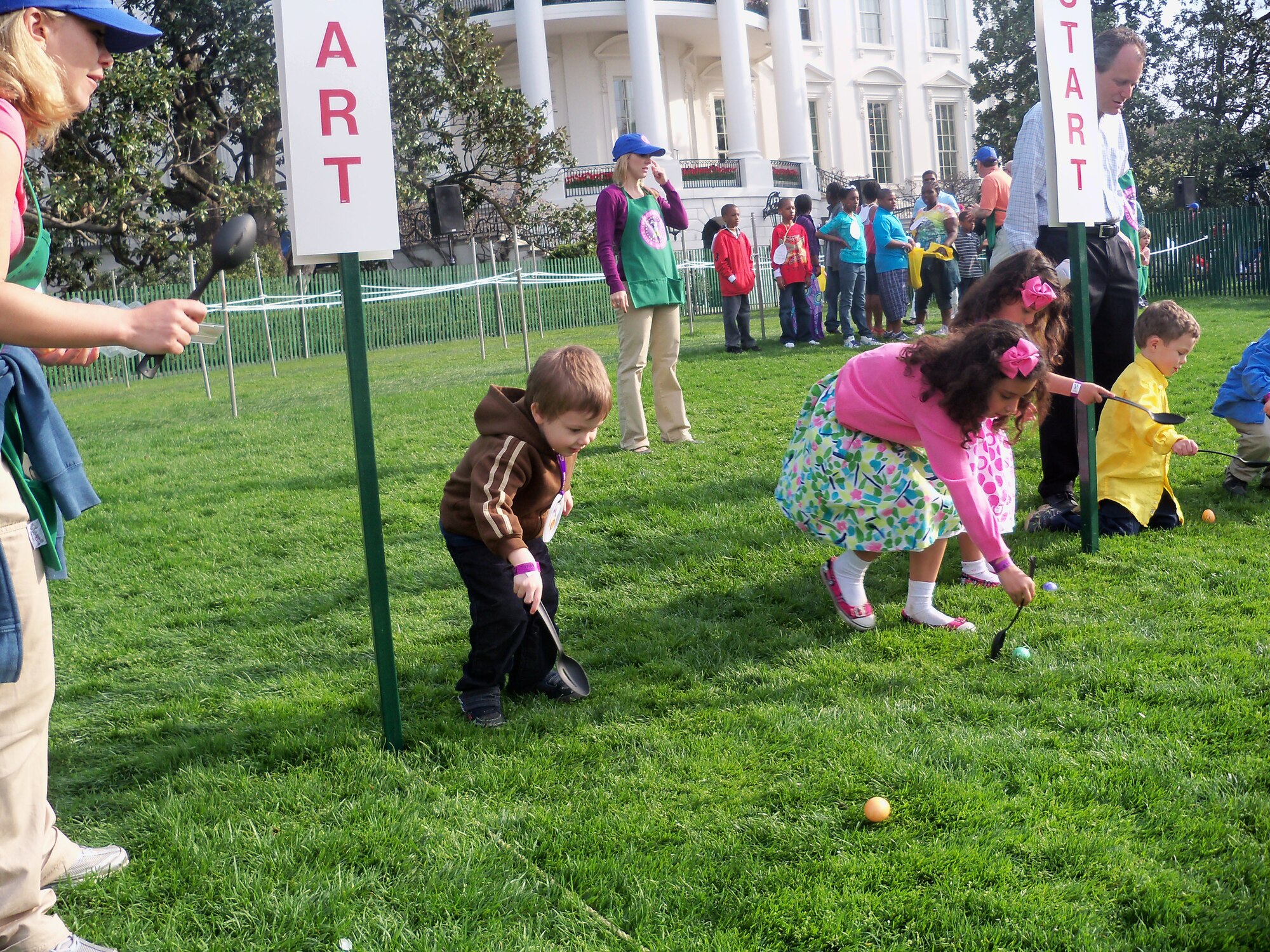 (Left) Chris Crews, son of Staff Sgt. Amber Palmer-Crews, 436th Civil Engineer Squadron, participates in the 2010 White House Easter Egg Roll April 5.  (U.S. Air Force courtesy photo)