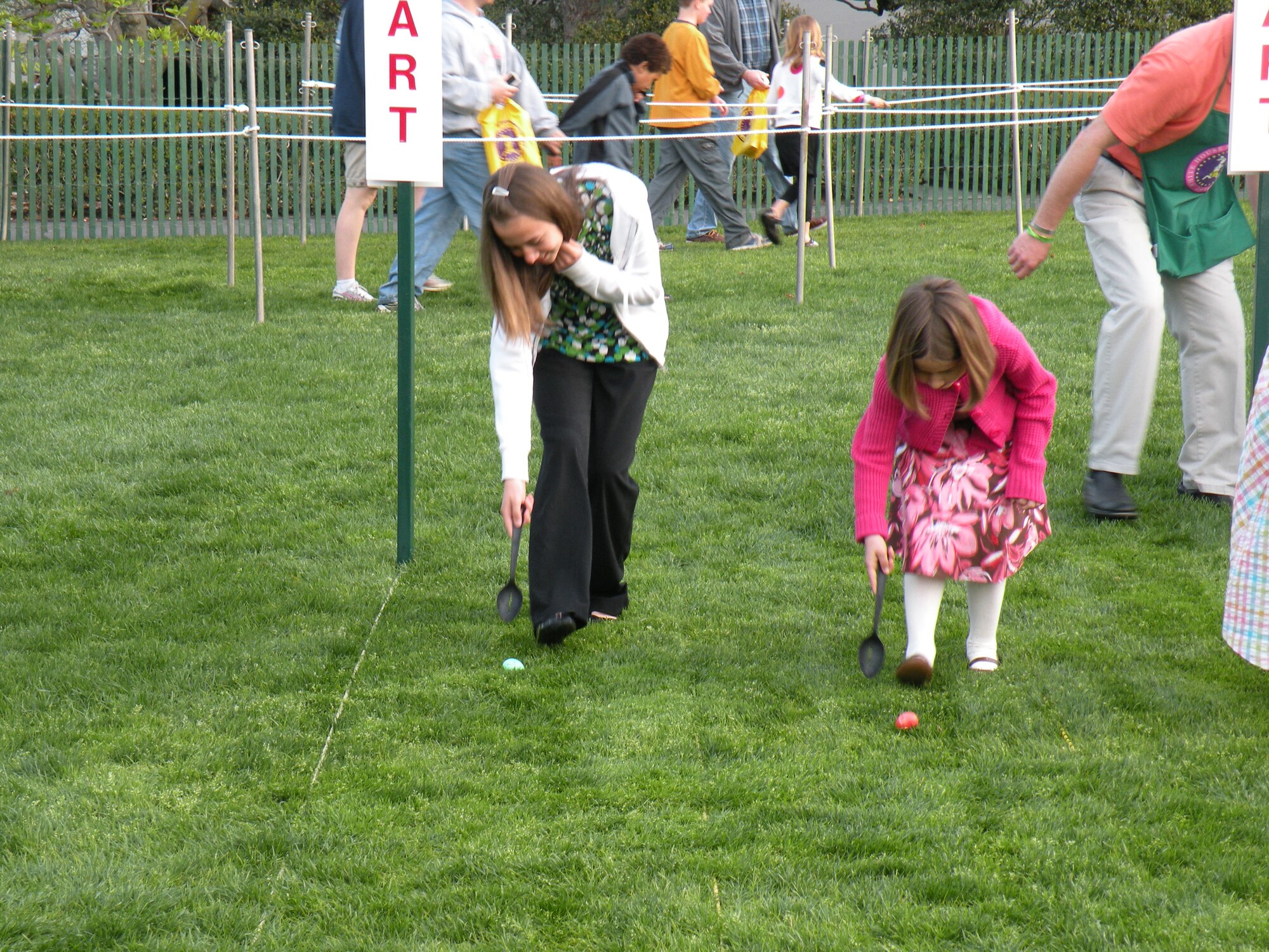(Left) Baylee and Carlee Watson, the daughters of Master Sgt. Michael Watson, 436th Operations Support Squadron, participate in the 2010 White House Easter Egg Roll April 5.  (U.S. Air Force courtesy photo)                 