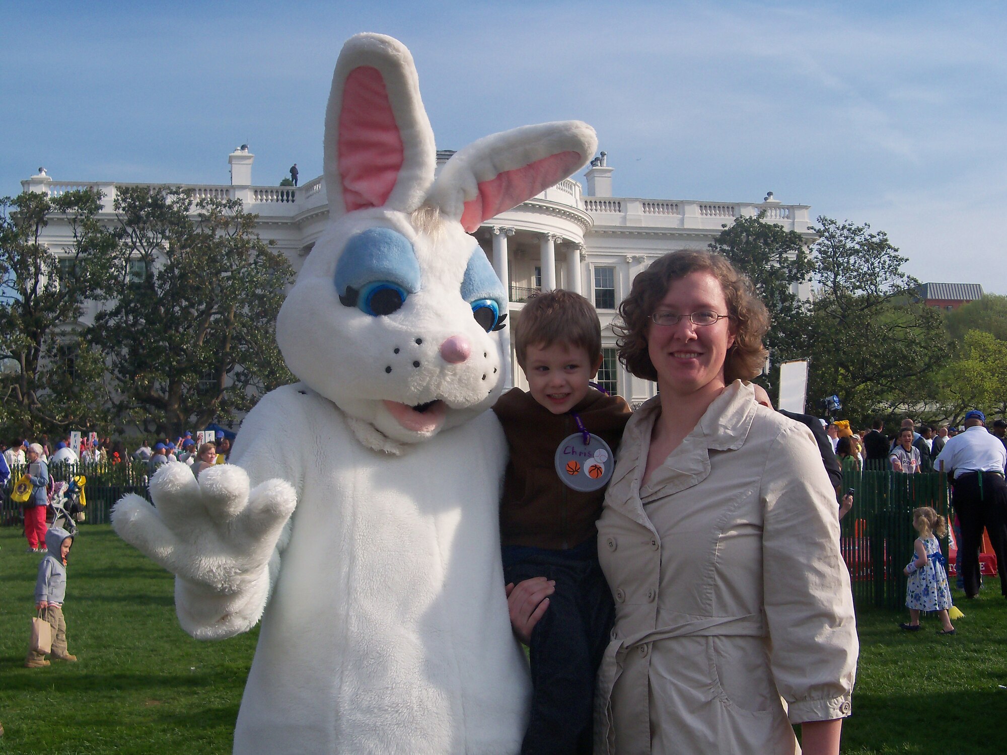 (Center)Chris Crews and his mother, Staff Sgt. Amber Palmer-Crews, 436th Civil Engineer Squadron, get their picture taken with the Easter Bunny April 5 during the 2010 White House Easter Egg roll.  (U.S. Air Force courtesy photo)