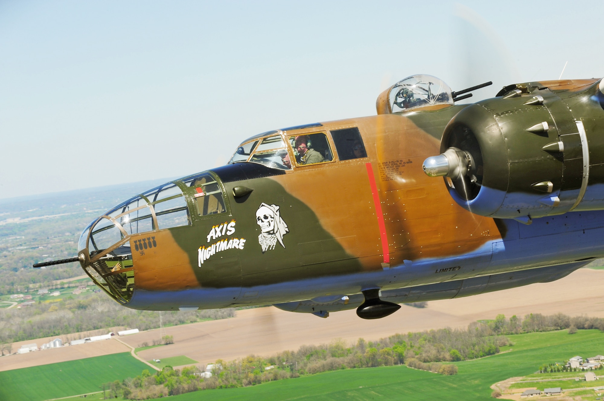 A vintage B-25 Mitchell bomber flies near the National Museum of the U.S. Air Force at Wright-Patterson Air Force Base, Ohio, April 18, 2010, during a memorial flight honoring the Doolittle Raiders. (U.S. Air Force photo/Tech. Sgt. Jacob N. Bailey)