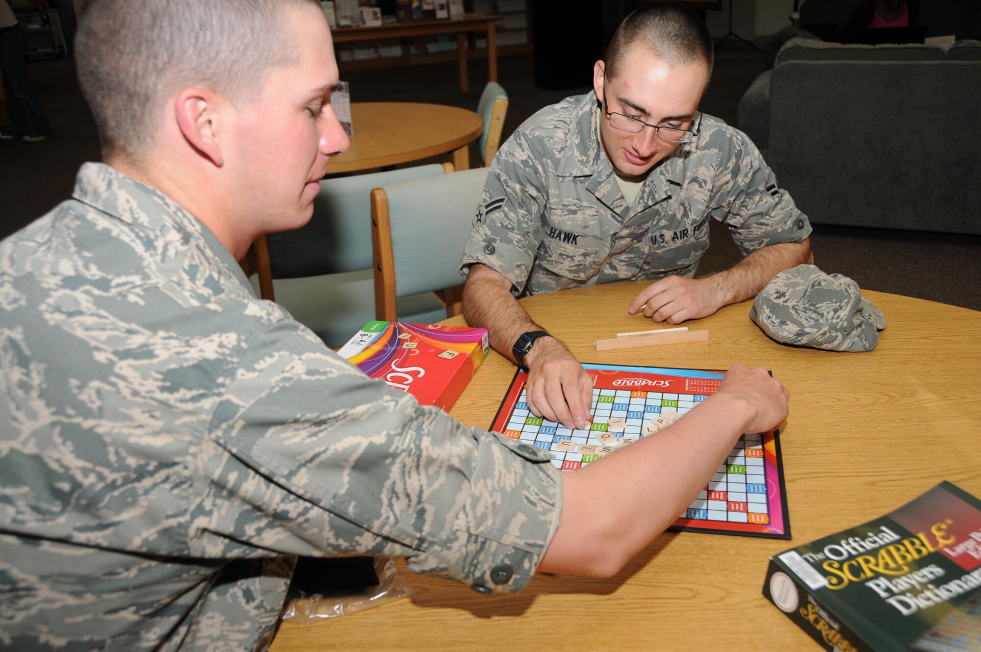 Airman Basic William Jones, left, and Airman 1st Class Nathan Hawk, students in the 332nd Training Squadron, play Scrabble during McBride Library’s open house and game day April 11.  Other events during Keesler’s observance of National Library Week April 11-17 were a comics night April 12, a Veterans of Foreign Wars and American Legion recognition night April 13, Kids Day story hour April 14, an after-tax party April 15, a quilting class April 17 and Saturday, a youth photography contest and art display.  (U.S. Air Force photo by Kemberly Groue)