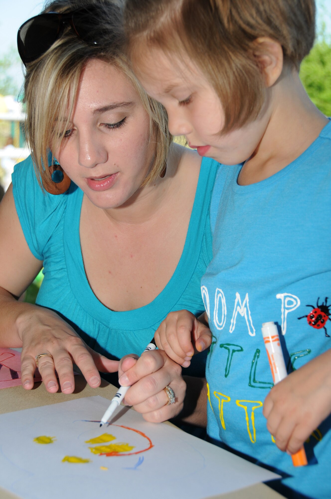 Crystal Simpson and her 5-year-old daughter, McKenna, work on a picture.  McKenna’s dad is Staff Sgt. Chris Simpson, 334th Training Squadron. (U.S. Air Force photo by Kemberly Groue)