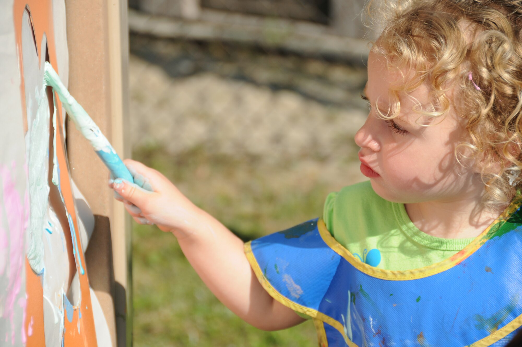 Two-year-old Aldyn Saucier paints a picture during the child development center's family fun day April 15.  Aldyn's parents are Brandie Saucier, 81st Diagnostics and Therapeutics Squadron, and Clint Saucier.  (U.S. Air Force photo by Kemberly Groue)