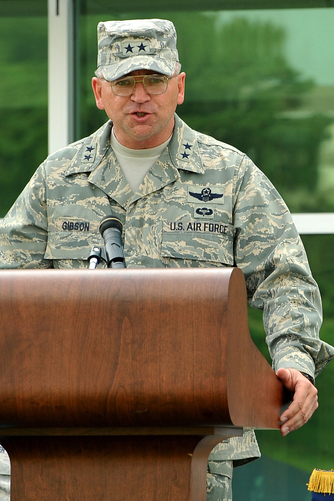 OFFUTT AIR FORCE BASE, Neb. -- Maj. Gen. Marke Gibson, Air Force director of operations and deputy chief of staff for operations, plans and requirements, speaks to attendees during the Air Force Weather Agency change of command ceremony in front of the Lt. Gen. Thomas S. Moorman building here April 20. The agency is comprised of more than 1,400 active-duty members, civil service employees and contractors at 14 operating locations around the world, which provide centralized weather products and services, including climatological and space weather support to all branches of the armed forces. U.S. Air Force photo by Charles Haymond