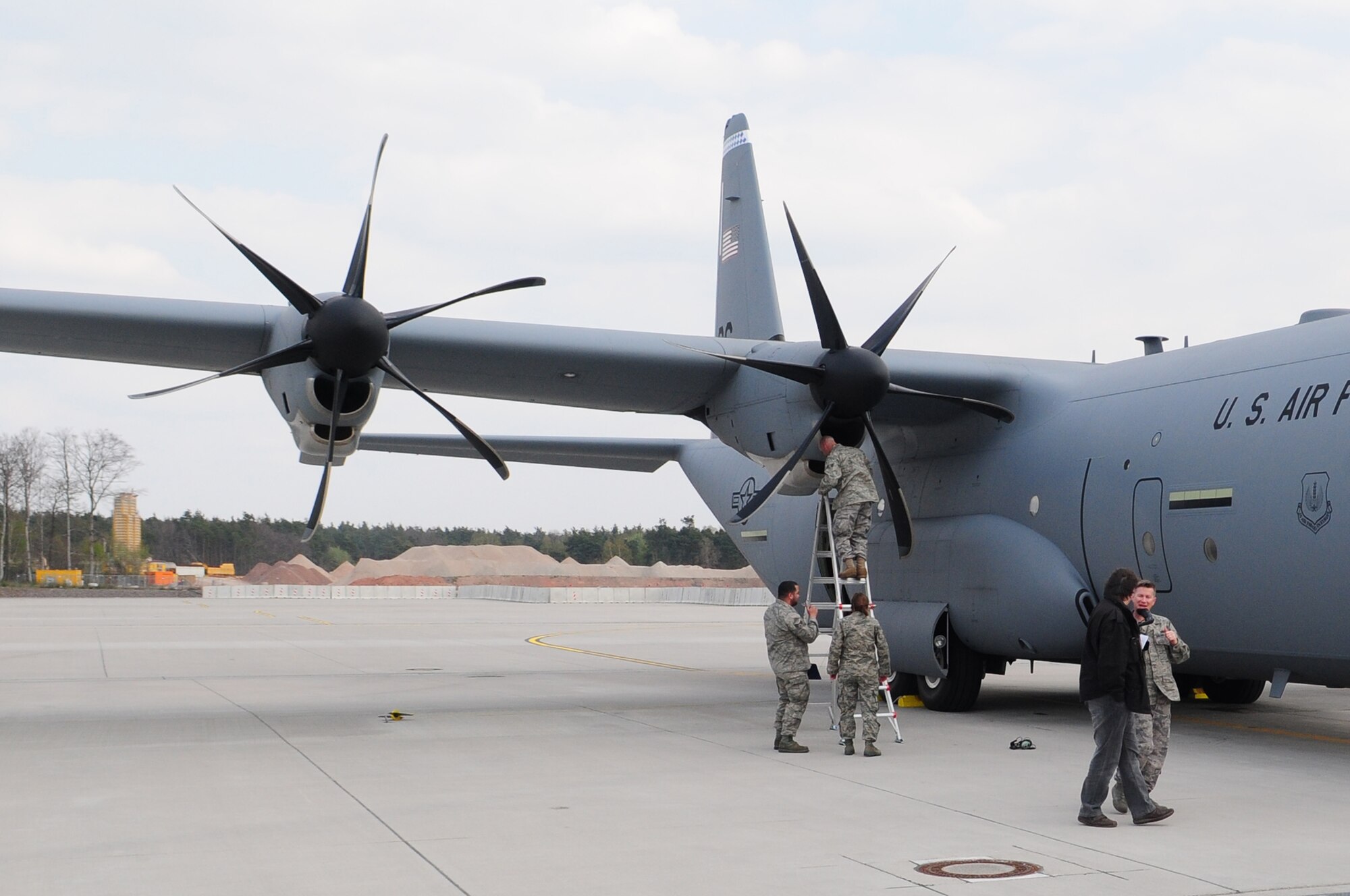 Maintenance personnel from the 86th Airlift Wing conduct an inspection on a C-130J  after a test flight April 21 on Ramstein. The test flight was conducted following the opening of German air space after nearly six days of air traffic restrictions due to ash in the atmosphere caused by a volcanic eruption in Iceland. The aircraft checked "clean," allowing for the wing to resume flying operations. Officials will continue to monitor the weather as the volcanic activity continues to be unpredictable.  (U.S. Air Force photo by Airman 1st Class Desiree Esposito)
