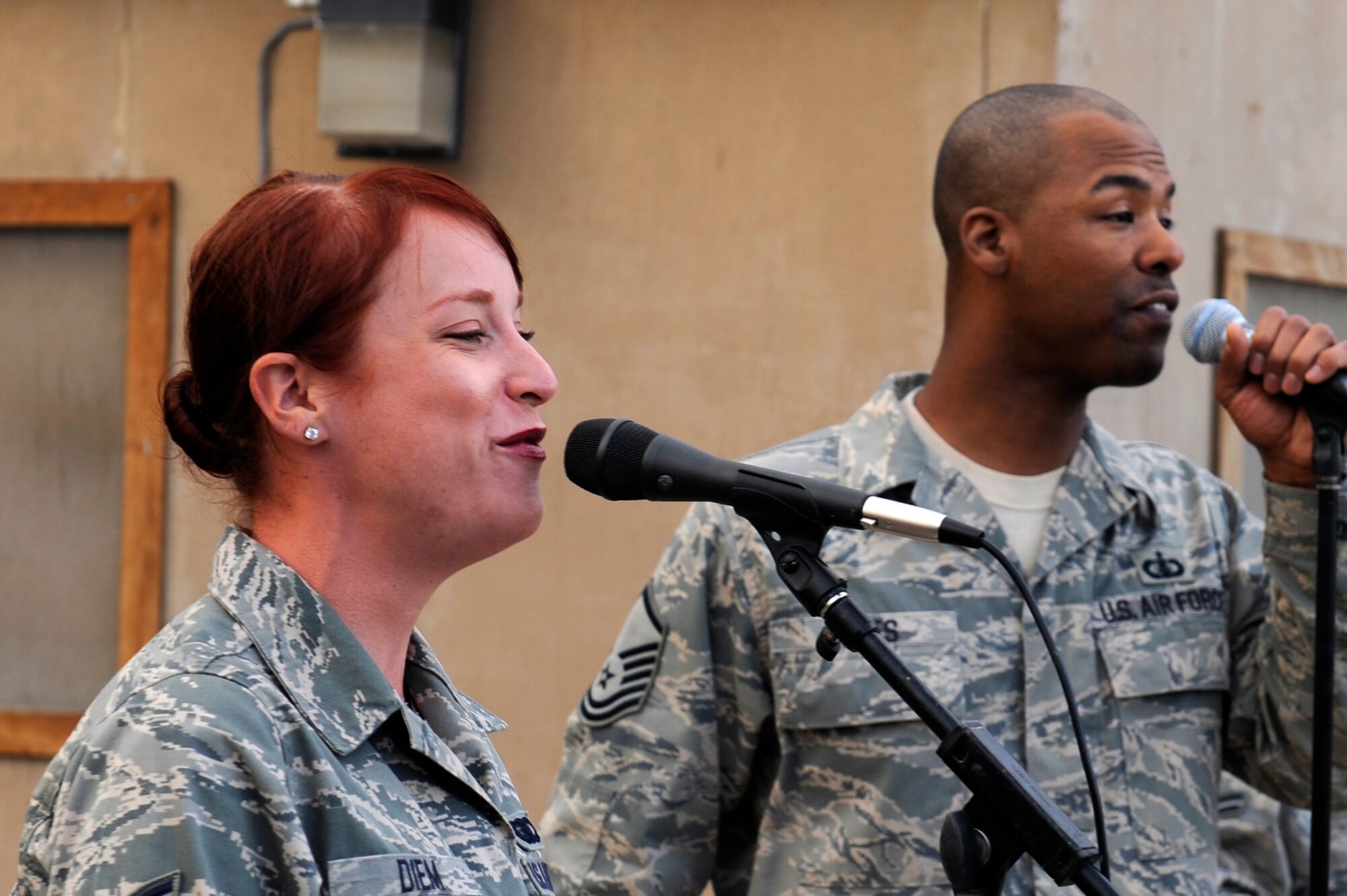 U.S. Air Force Airman 1st Class Jill Diem, and Master Sgt. Aaron Miles, members of the Air Forces Central Expeditionary Band, Reserve Generation, perform at Bagram Airfield, Afghanistan, April 18, 2010. (U.S. Air Force photo by/ Tech. Sgt. Jeromy K. Cross/released)








