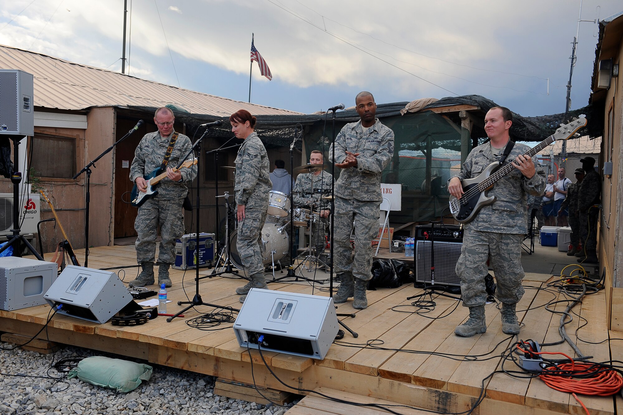 U.S. Air Force Senior Airman Jack Bowers, Airman 1st Class Jill Diem, Master Sgt. Aaron Miles, Airman 1st Class Darren King (left to right), and Tech. Sgt. David Vittetoe (back), members of the Air Forces Central Expeditionary Band, Reserve Generation, perform at Bagram Airfield, Afghanistan, April 18, 2010. (U.S. Air Force photo by/ Tech. Sgt. Jeromy K. Cross/released)







