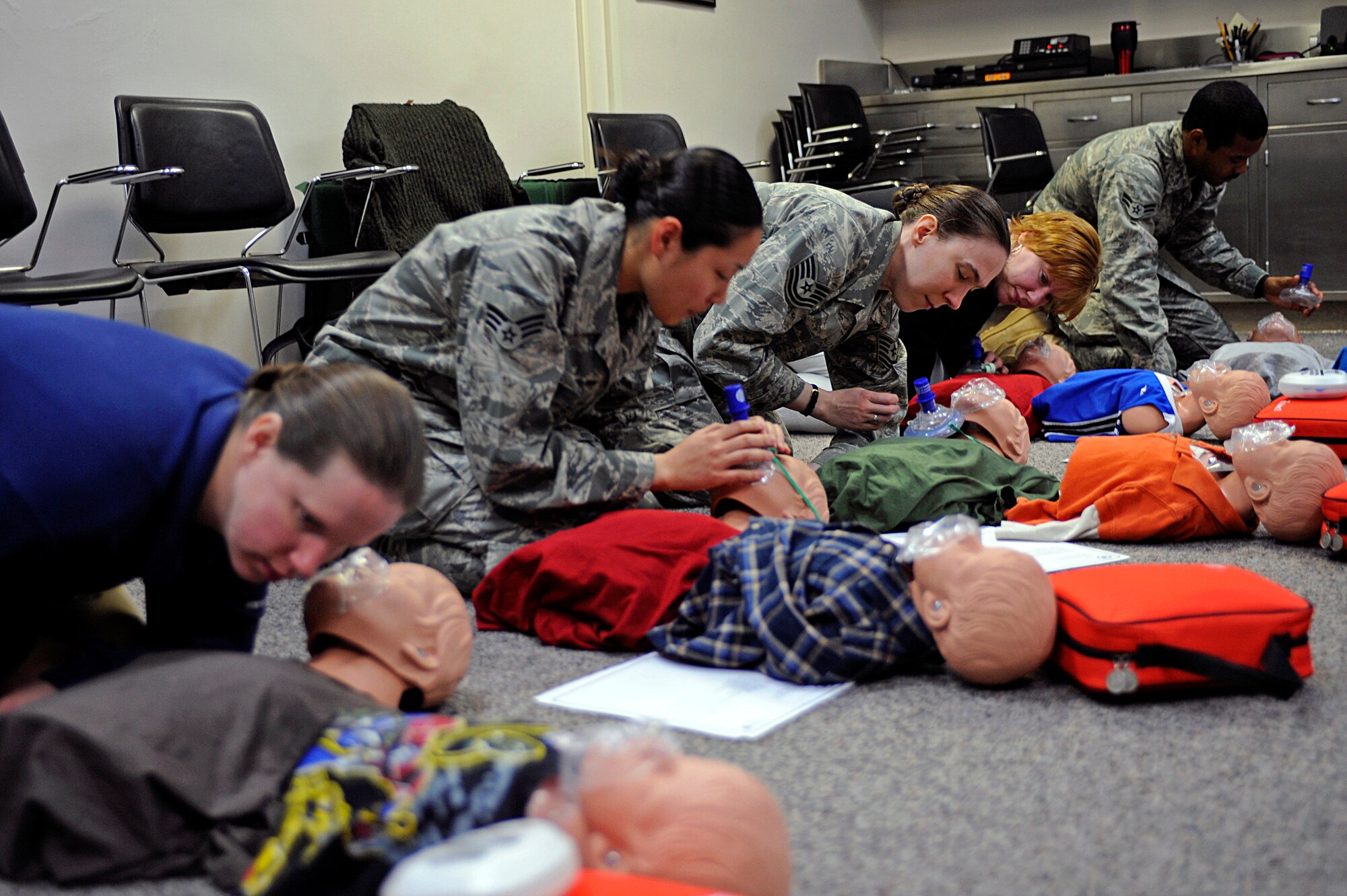 ELLSWORTH AIR FORCE BASE, S.D. - Participants of a heart saver certification course perform cardio pulmonary resuscitation on dummies, April 20. CPR on an adult requires 30 chest compressions for every two breaths. (U.S Air Force photo/Airman 1st Class Matthew Flynn)