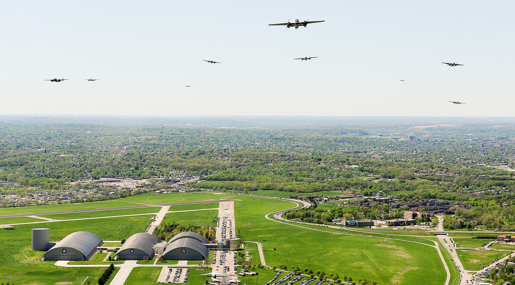 B-25 Mitchells fly over the National Museum of the U.S. Air Force during a memorial flight honoring the Doolittle Tokyo Raiders April 18, 2010, at Wright-Patterson Air Force Base, Ohio.  (U.S. Air Force photo/Tech. Sgt. Jacob N. Bailey) 