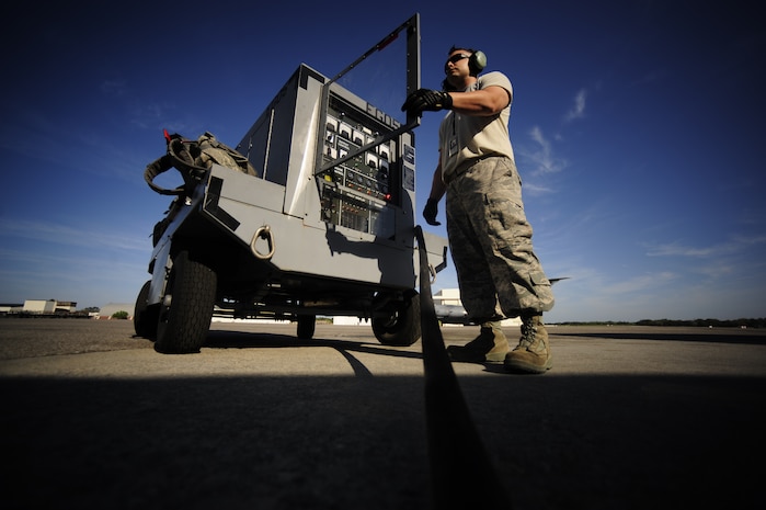 U.S. Air Force Staff Sgt. Mark Graveline operates an aircraft auxiliary power unit on the flightline at Joint Base Charleston, S.C., prior to a C-17 mission to North Auxiliary Airfield in North, S.C., April 7, 2010. The power units are utilized to perform preflight checks on an aircraft before engine startup, reducing wear and tear on the aircraft's auxiliary power unit and also saving fuel. Sergeant Graveline is an aircraft crew chief with the 315th Aircraft Maintenance Squadron. (U.S. Air Force photo/Tech Sgt. Jacob Bailey)