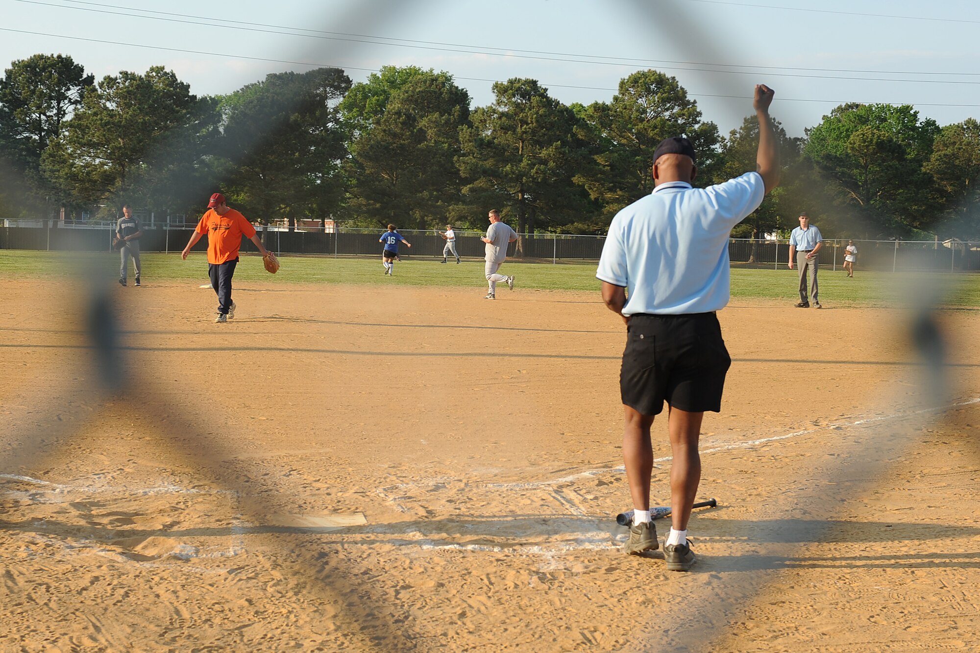 SEYMOUR JOHNSON AIR FORCE BASE, N.C. -- Eric Harper announces the end of the second inning during an intramural softball game here between the 4th Equipment Maintenance Squadron and 4th Medical Group, April 13, 2010. Mr. Harper, Seymour Johnson Air Force Base intramural referee, hails from Detroit. (U.S. Air Force photo/Senior Airman Whitney Lambert)