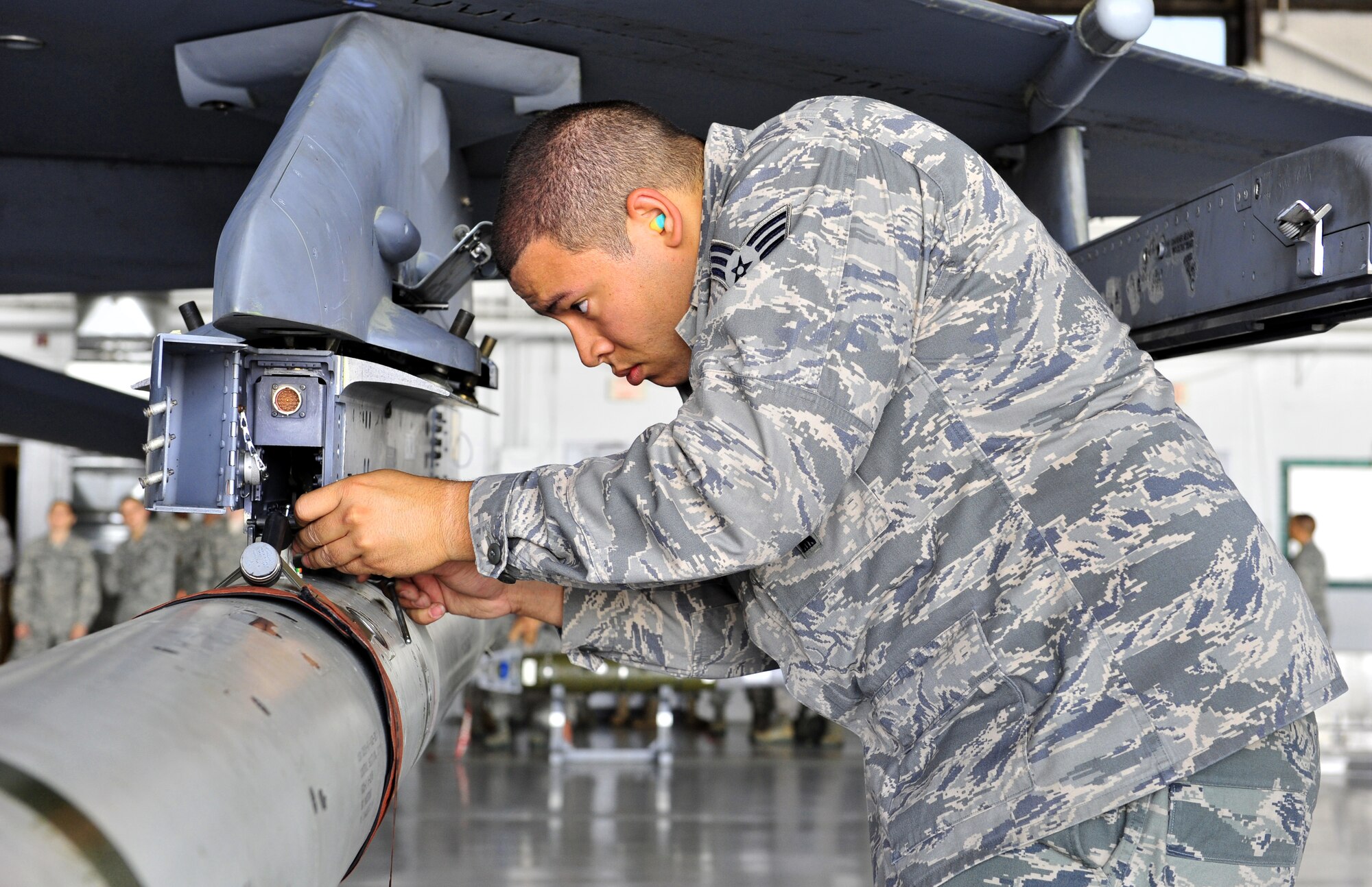 100416-F-8430J-088
SHAW AIR FORCE BASE, S.C. -Senior Airman Dartagnan Powell, 79th Aircraft Maintenance Unit, secures a missile on to the F-16 April 16, 2010. Wing weapons standardization held the first Weapons Load Crew of the Quarter Competition for 2010. The 55th and 79th Aircraft Maintenance Units Weapons load crews competed against each other in a race against time. Both load crews were tasked to load two air intercept missiles (AIM - 120) and two air-to-ground missiles (AGM - 88) within 45 minutes.  (U.S. Air Force photo/Airman 1st Class Amber E. N. Jacobs)

